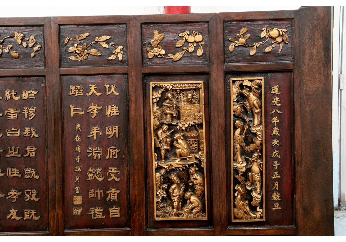 A large and intricate Asian carved and gilt panel that may be utilized as an architectural element, wall decoration or screen. In one piece with six panels with four recessed sections each with carved and gilt decoration. The top sections with vines