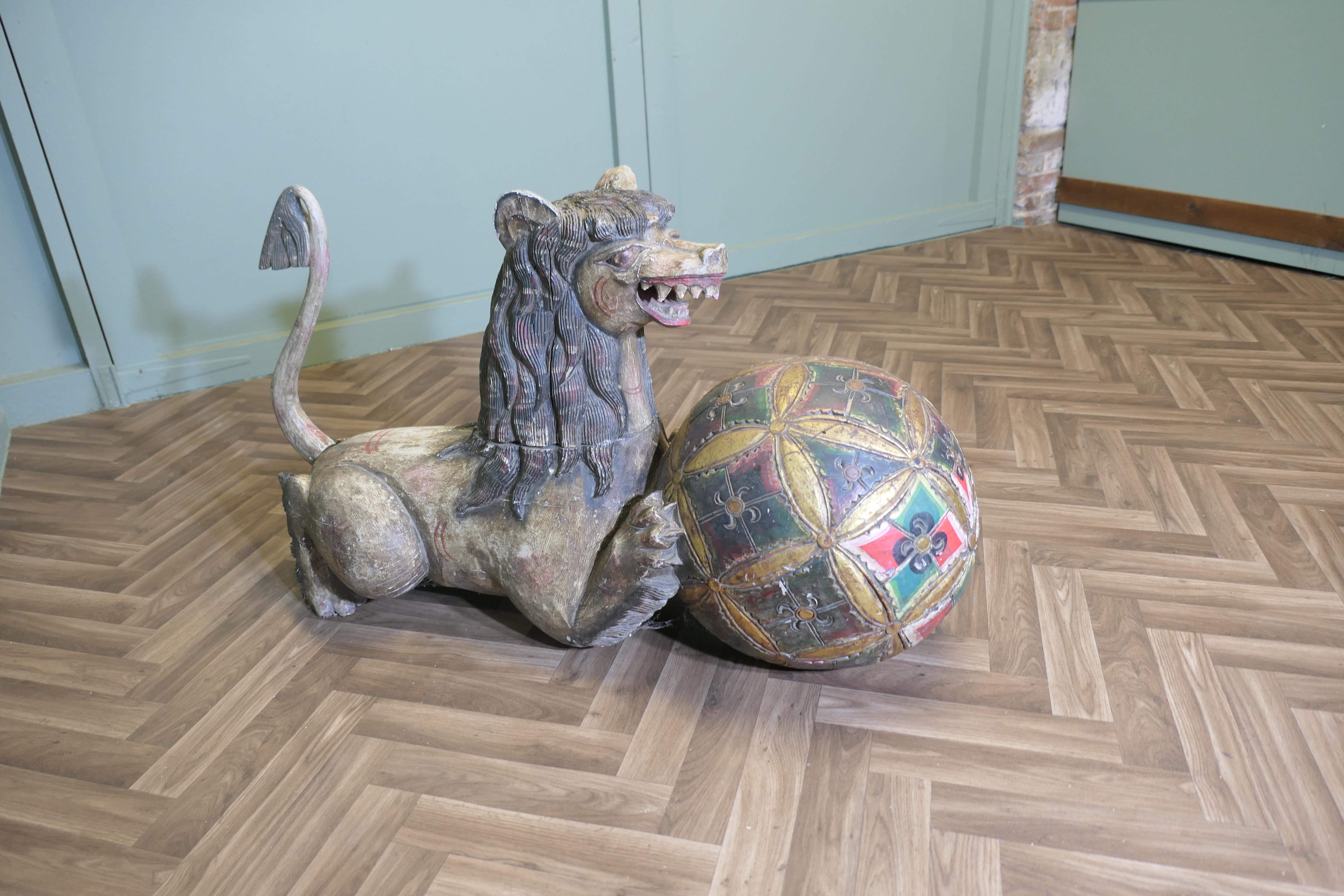 Large Carved and Painted Temple Lion, Pixiu or Foo Dog
This fierce looking beast dates from the 19th Century, he is carved in wood and was originally painted Much of the paint 1s faded and worn away but there is still plenty to be seen especially on
