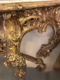 Large carved and parcel gilt rococo console table with white marble top