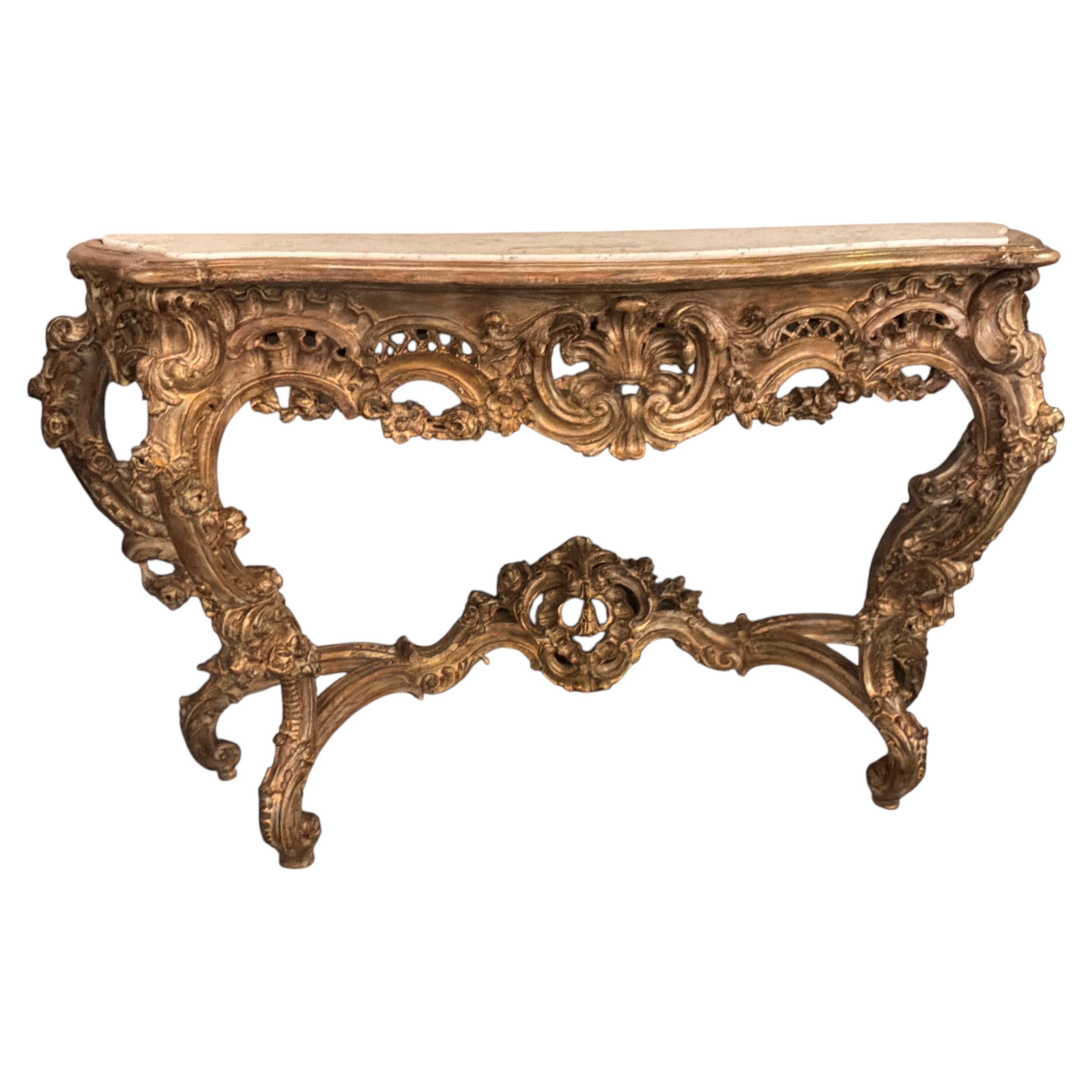 Large carved and parcel gilt rococo console table with white marble top