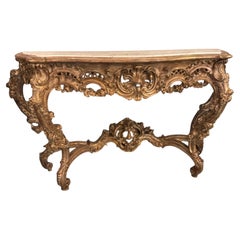 Large carved and parcel gilt rococo console table with white marble top