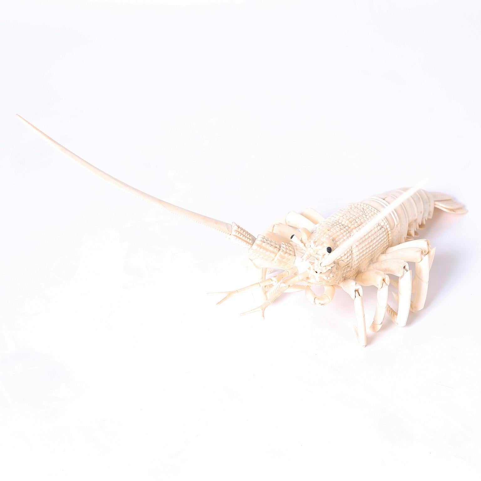 Life like articulated lobster carved of bone.