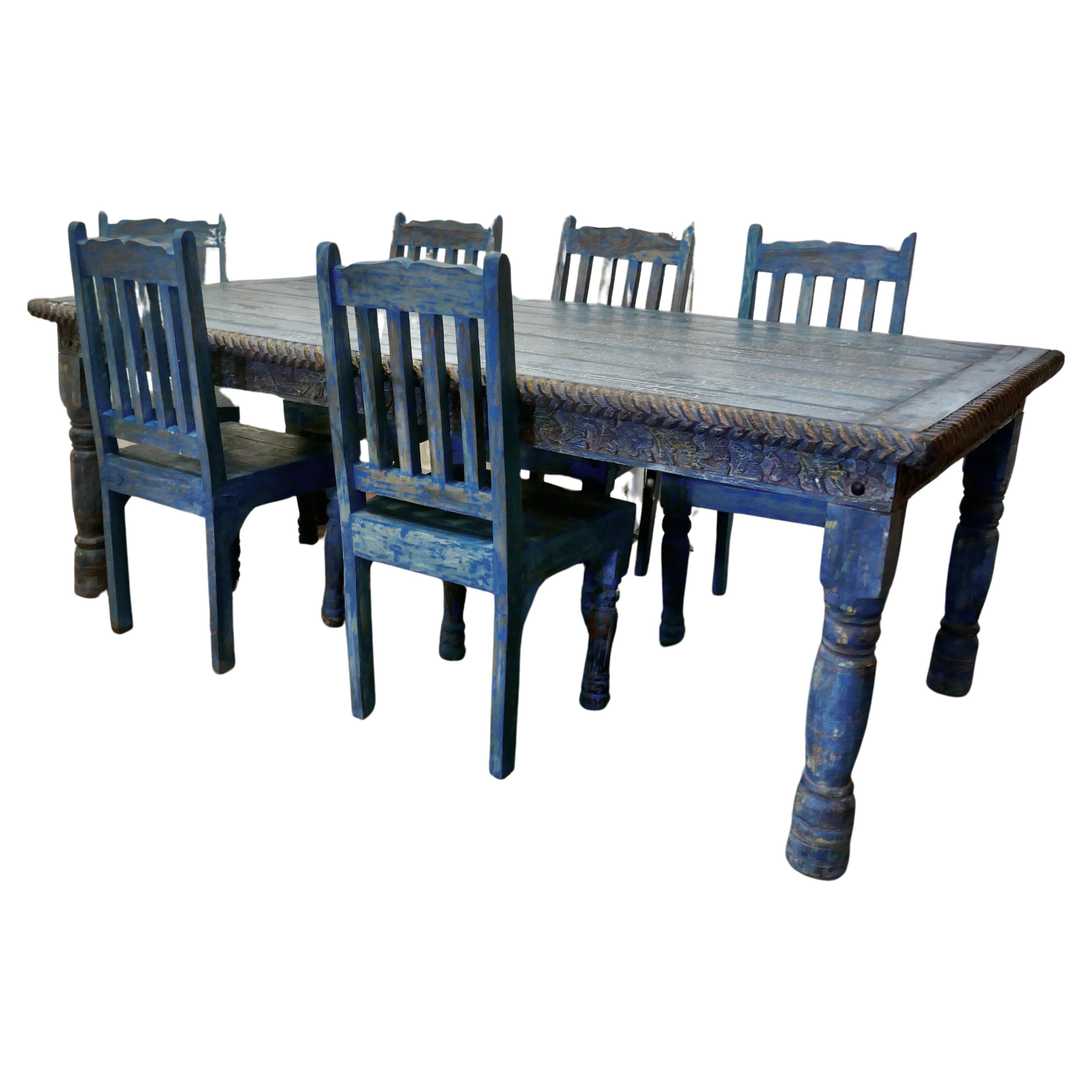 Large Carved Folk Art Painted Table and 6 Chairs 

This is a Large, Wide Table it seats 6 or 8 people very comfortably, it has a very unusual crackle painted top 
The table has turned legs and has a carved apron with a rope twist edge around the