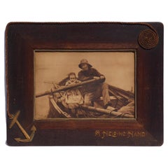 Large Carved Frame Decorated with a Nautical Theme and Holding a Nautical Print