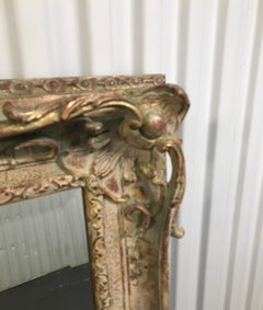 Grand miroir sculpté, doré et peint