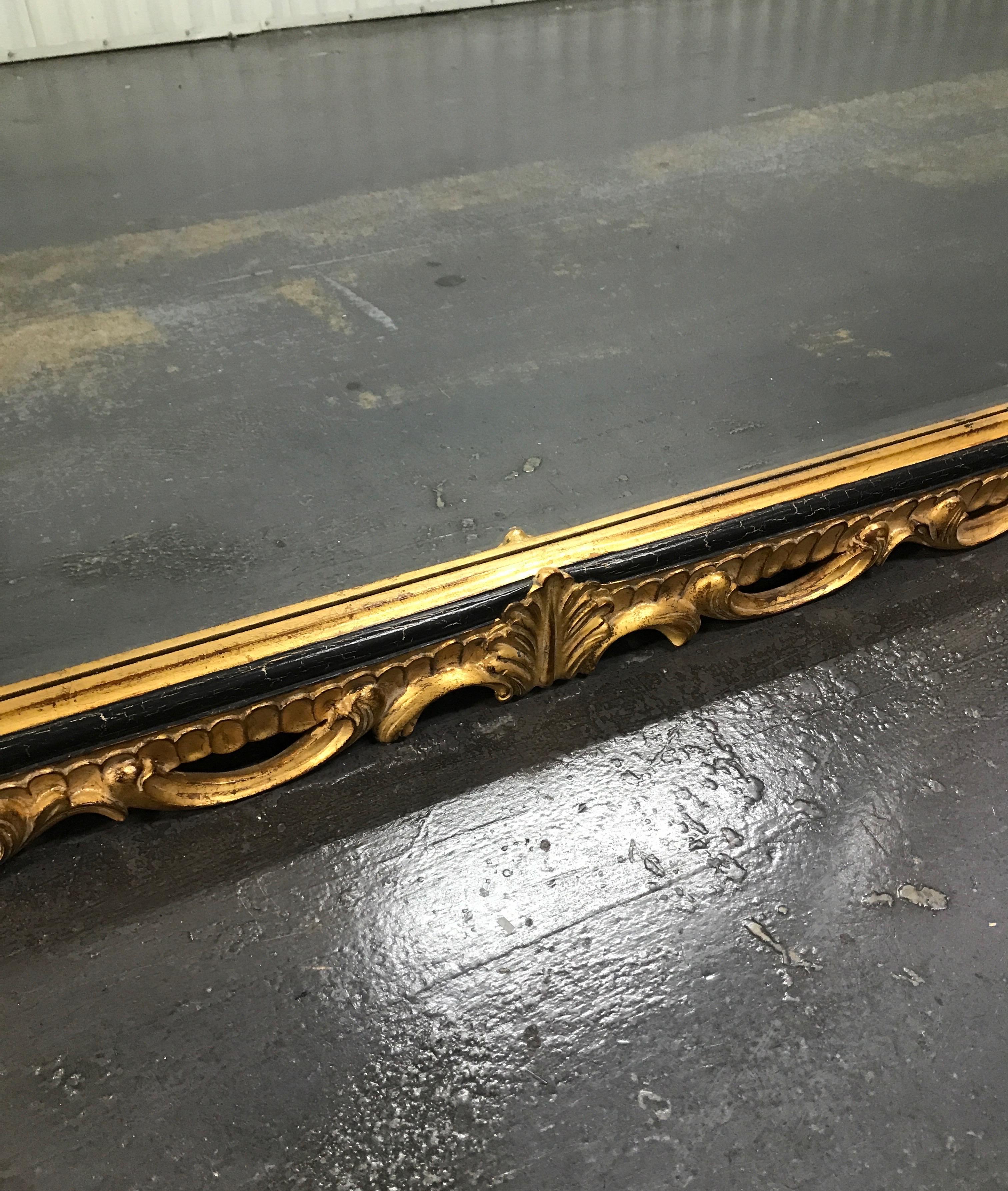 American Large Carved and Gilded Shell Topped Dauphine Mirror by Harrison & Gil