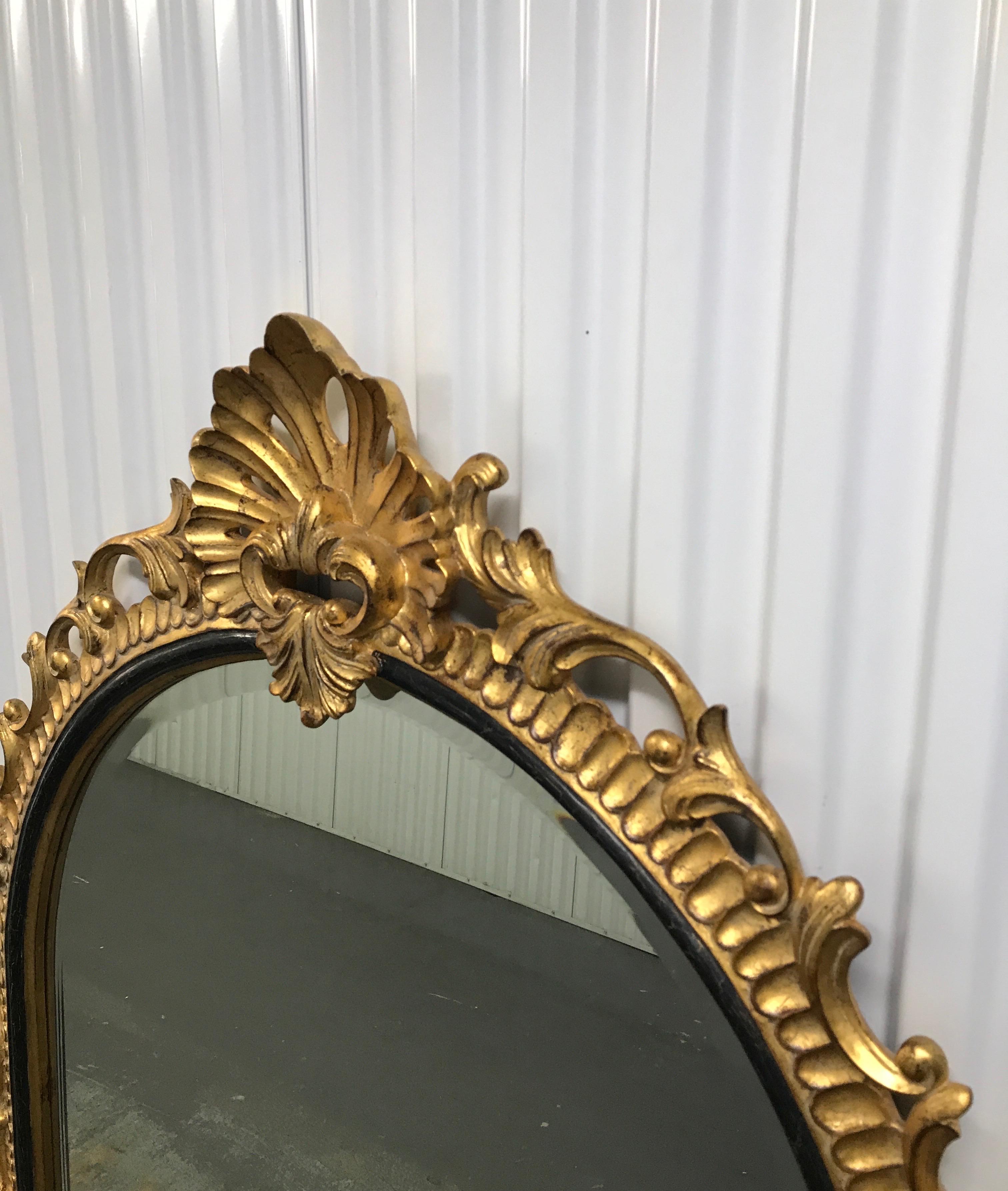 20th Century Large Carved and Gilded Shell Topped Dauphine Mirror by Harrison & Gil
