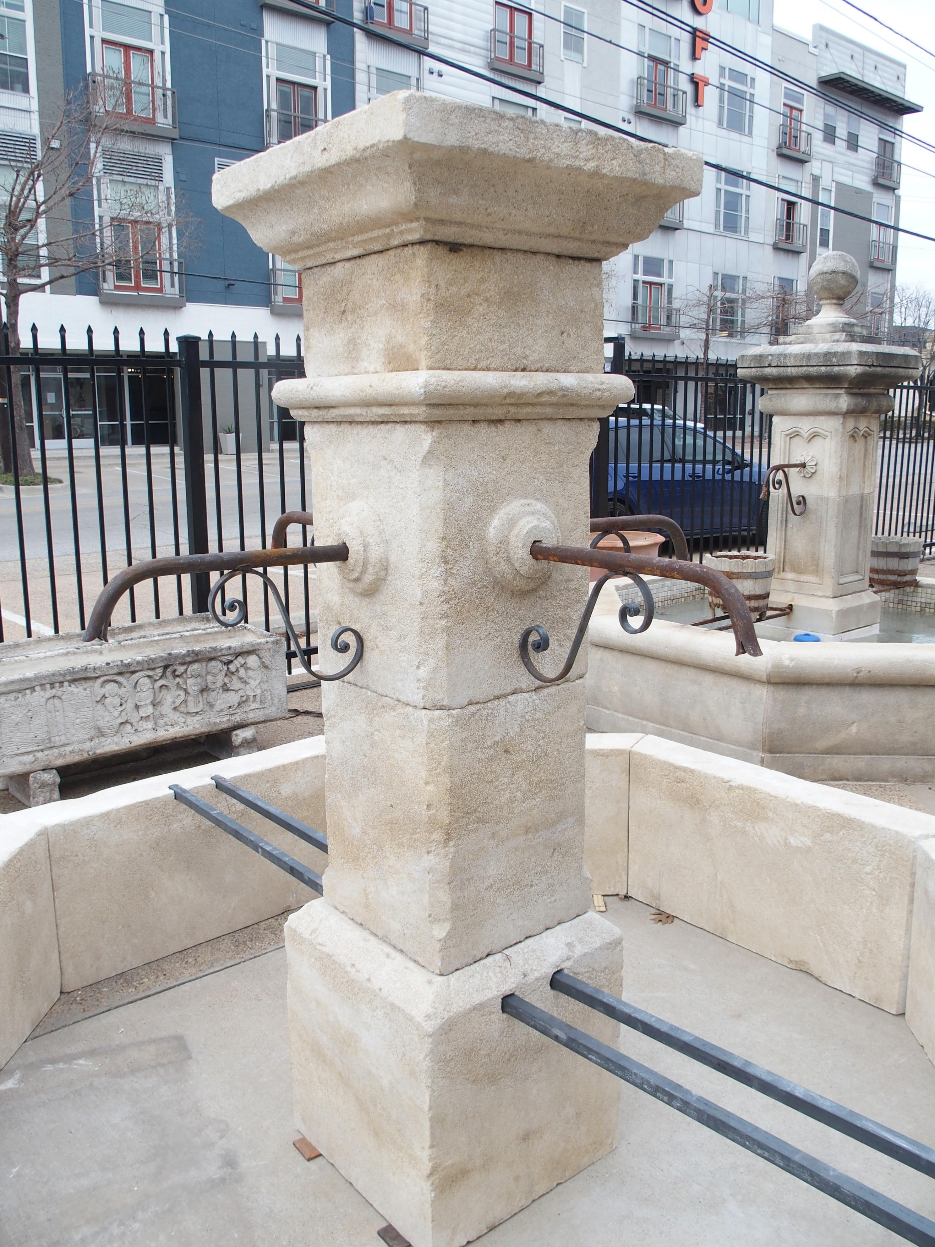 Hand-carved in Provence, France, this large center village fountain is comprised of 14 pieces of Estaillade limestone. Each stone has a cream finish with white and gray accents, expertly added by French artisans using a centuries-old technique.

The