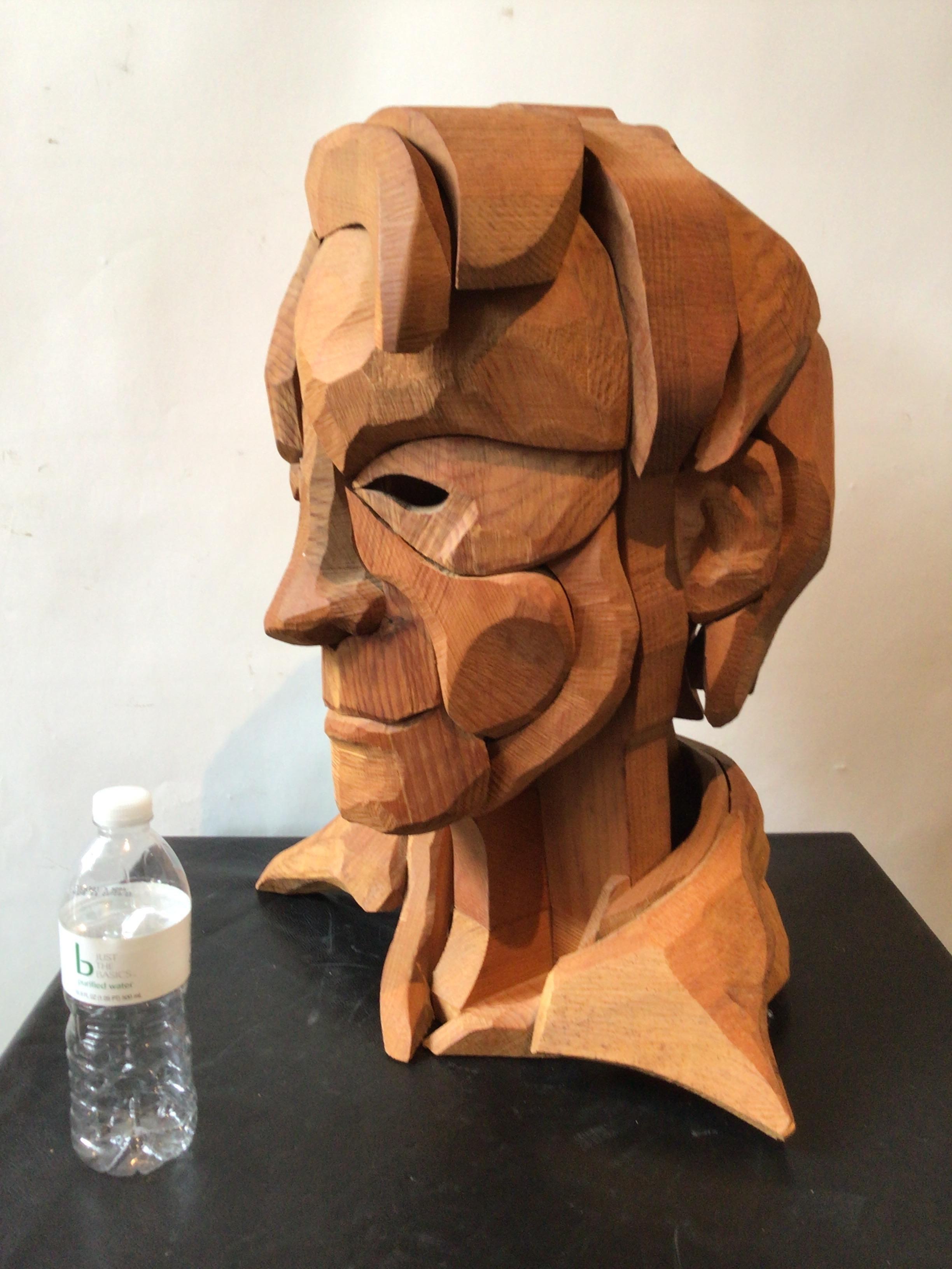 1960s Large carved wood head of a male made from individual pieces of wood.