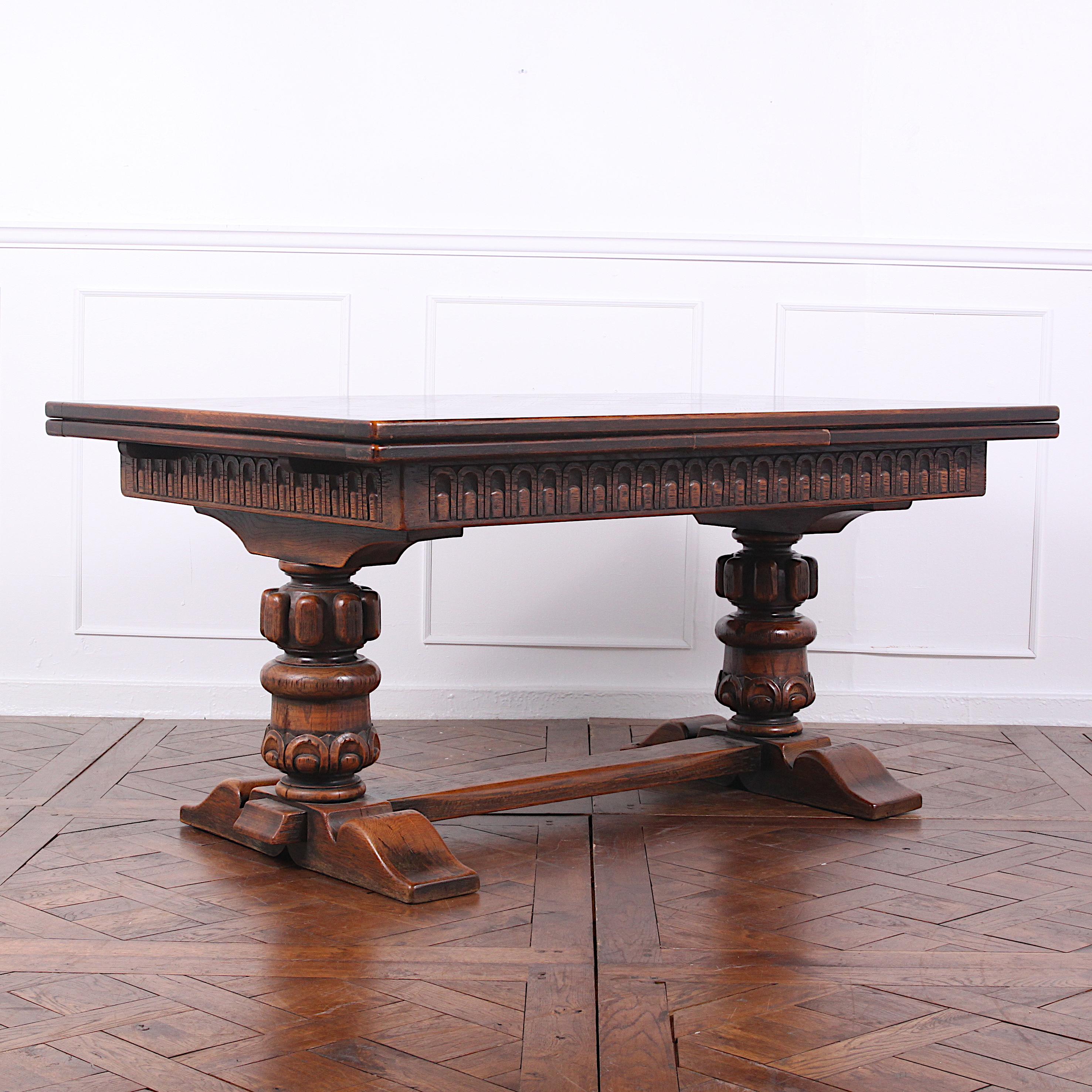 Early 20th Century Large Carved Oak Flemish Draw-Leaf Table