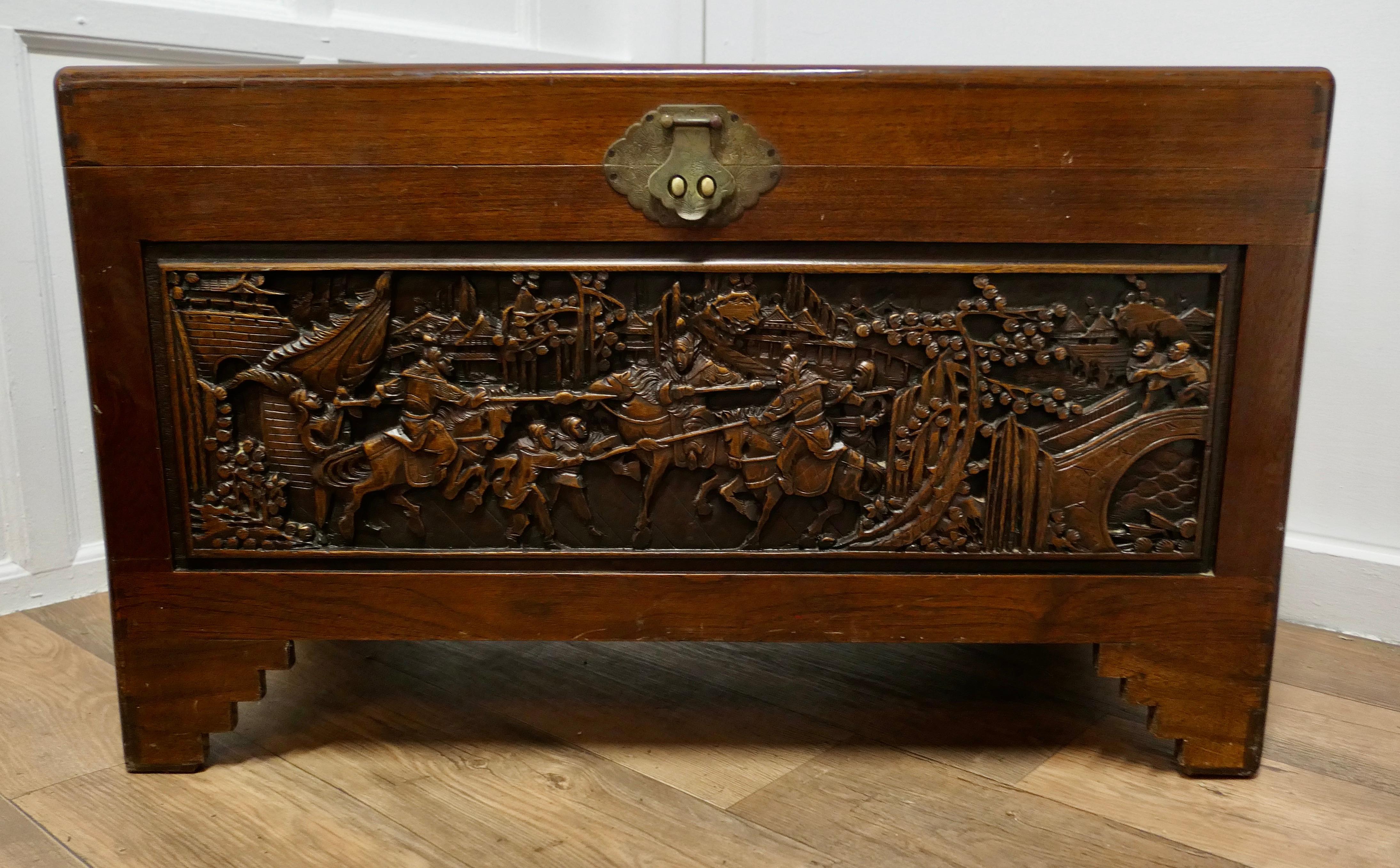 Large Carved Oriental Camphor Wood Chest

This Carved Chest is made from Camphor Wood, for those of you who do not know camphor wood it is a hard wood which lends itself very well to carving.
However the main reason for using camphor wood is its