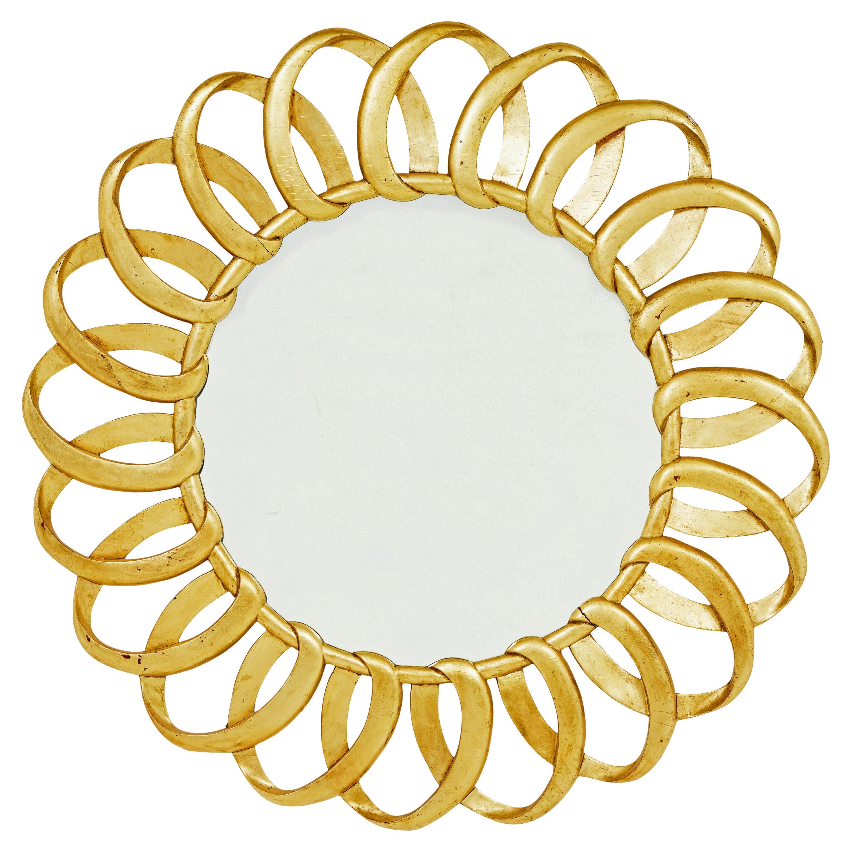 Large carved rococo influenced gilt wall mirror For Sale
