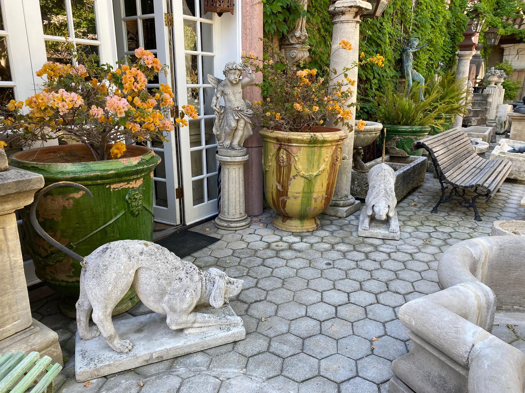 Pair Carved Stone Figures Of Hunting Dogs Garden Antique Statuary Animal Lovers . PRICED FOR THE PAIR. 
beautiful Chateau De Chasse hand carved stone dogs large size  mounted on top and attached to a reinforced base and wrists. Metal tail. Lifesize