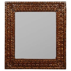Grand miroir mural en teck sculpté