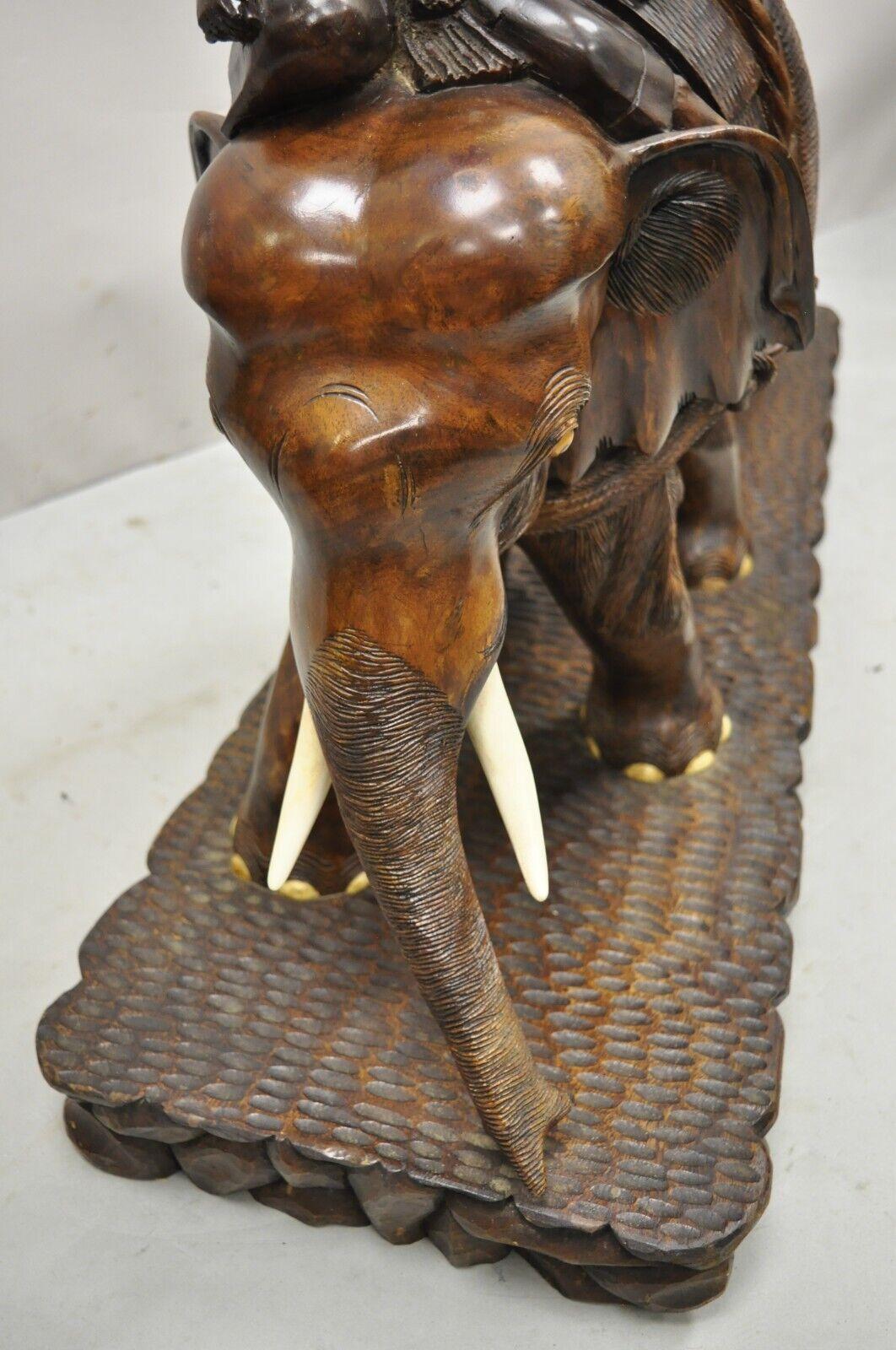 Large Carved Teak Wood Elephant Pulling Log Burmese Sculpture Figure In Good Condition In Philadelphia, PA