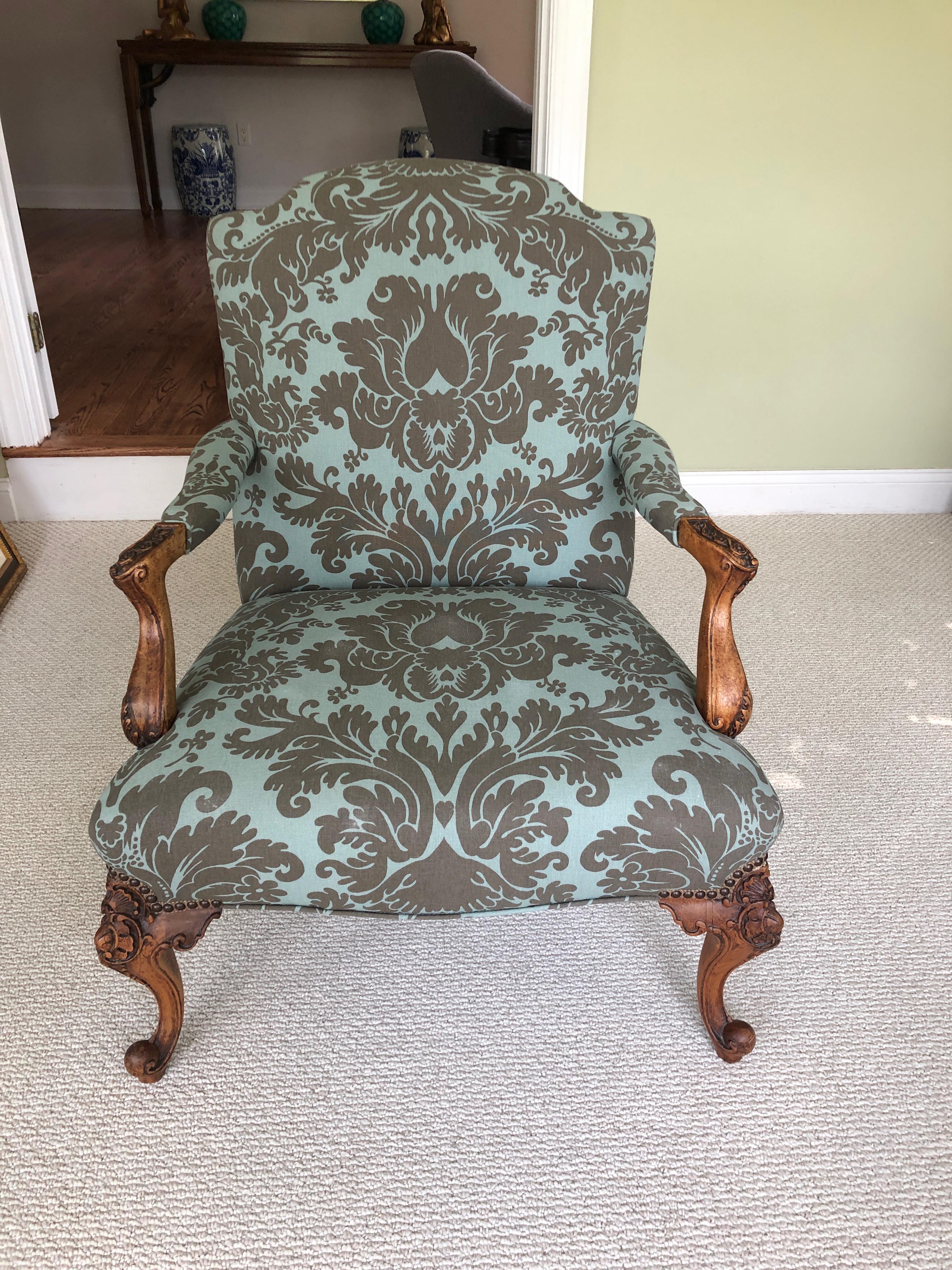 Classic French style Louis XVI carved light walnut armchair having grey and light blue patterned upholstery.
Measures: Arm height 24, seat depth 22.