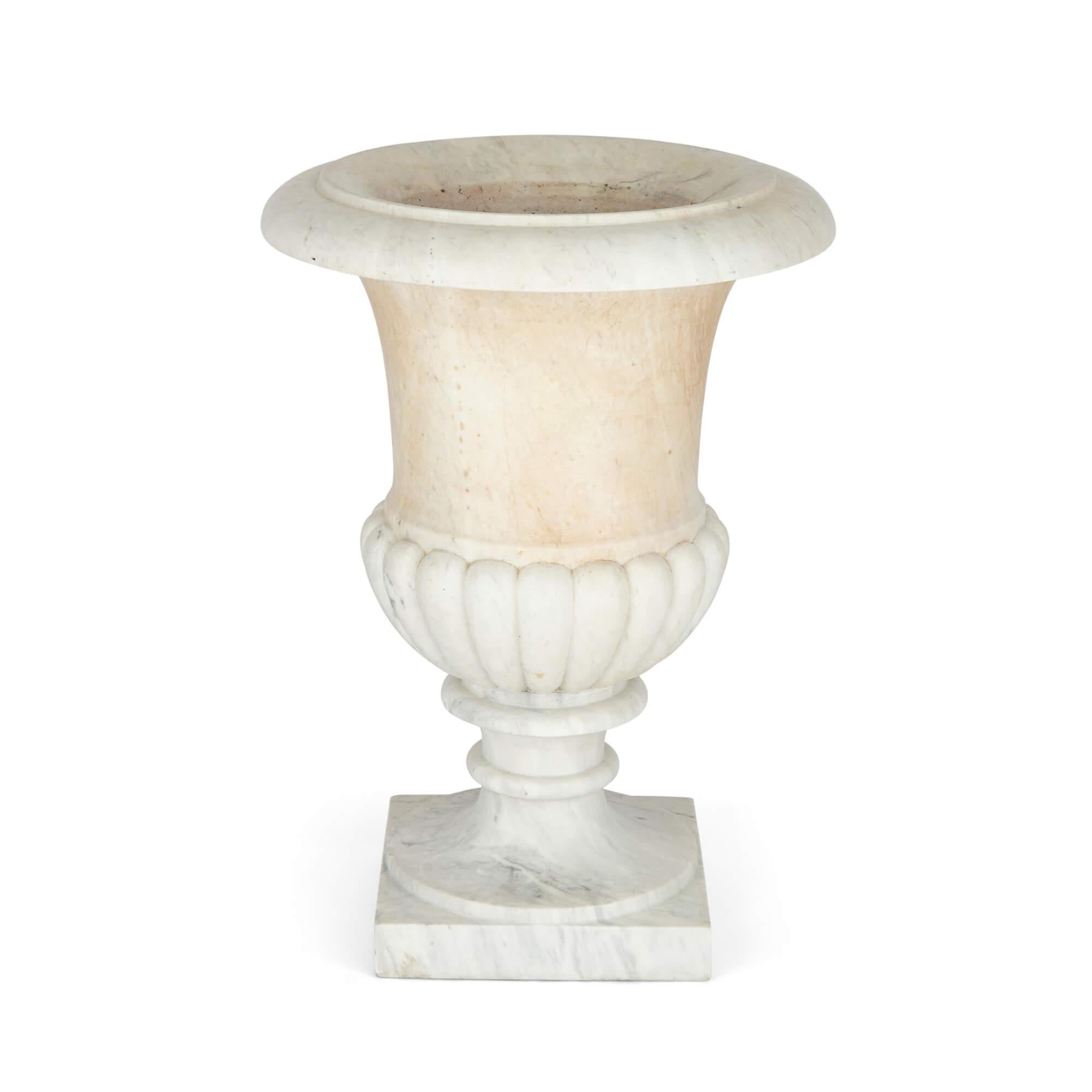 Large carved white marble campagna-form garden urn
Continental, 19th century
Measures: height 60cm, diameter 42cm

Crafted from white marble, this fine garden urn is carved in the familiar campagna form of that of the well-known Medici vase to