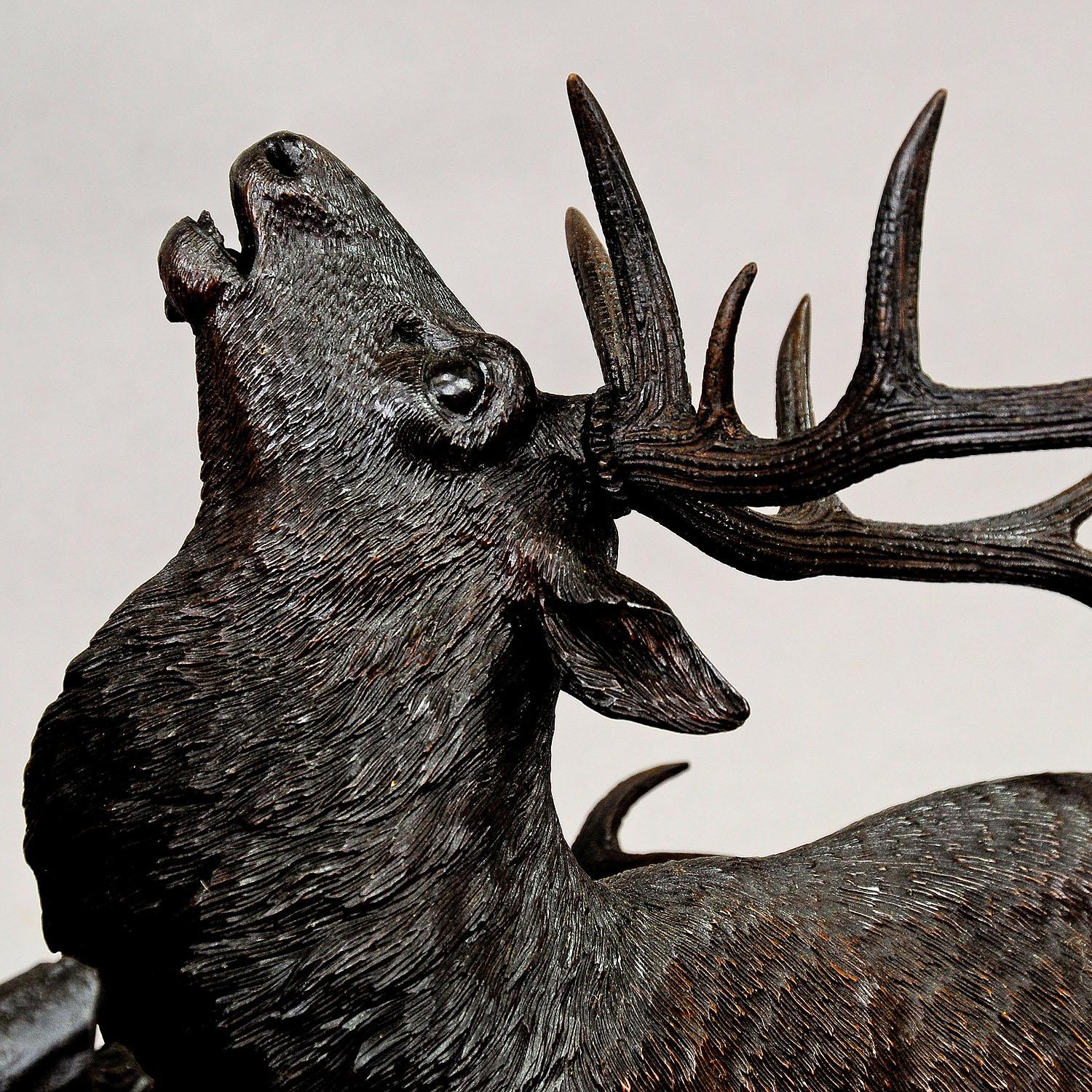 20th Century Large Carved Wood Fighting Stags by Rudolph Heissl