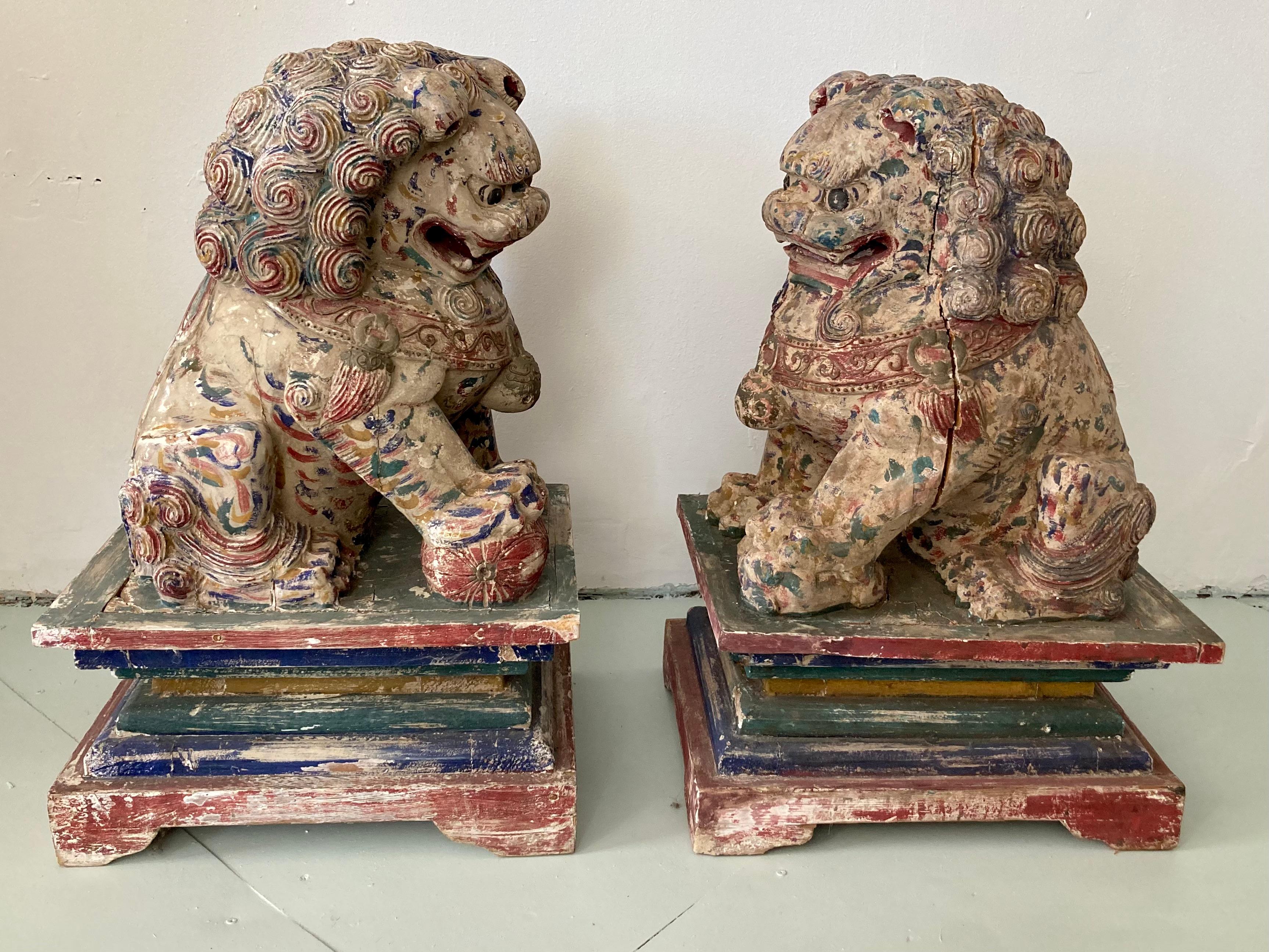 Pair of vintage palace size large carved wood foo dogs. Amazing carved wood details . Fun Fact from the estate of Kirk Douglas Great addition to your chinoiserie collection.