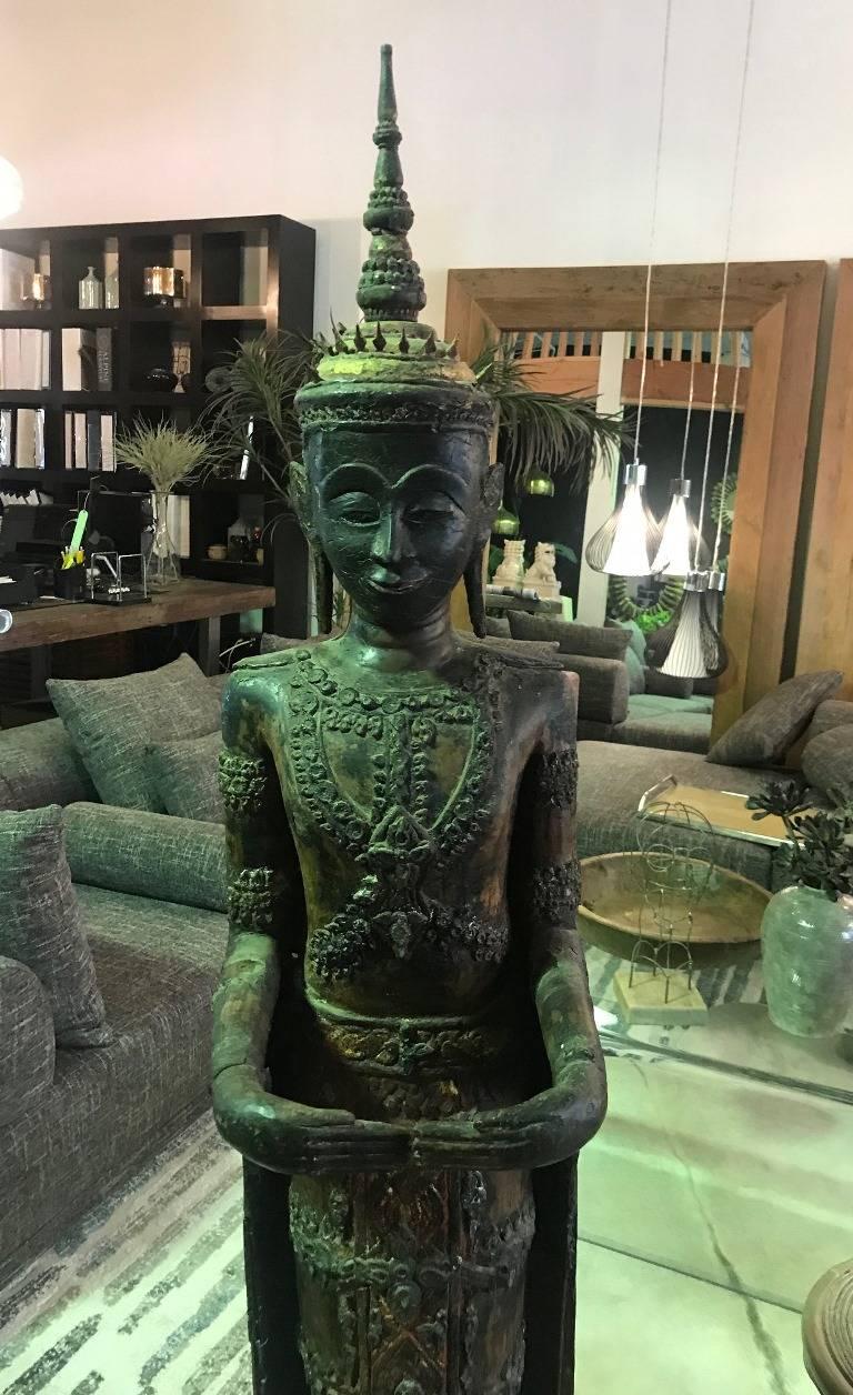Ornately carved and decorated and standing nearly 6 foot tall. This is truly a mesmerizing piece. Likely Thai but could also be from Laos as they share many similar features and characteristics. 

We are listing as 19th century but feel the work