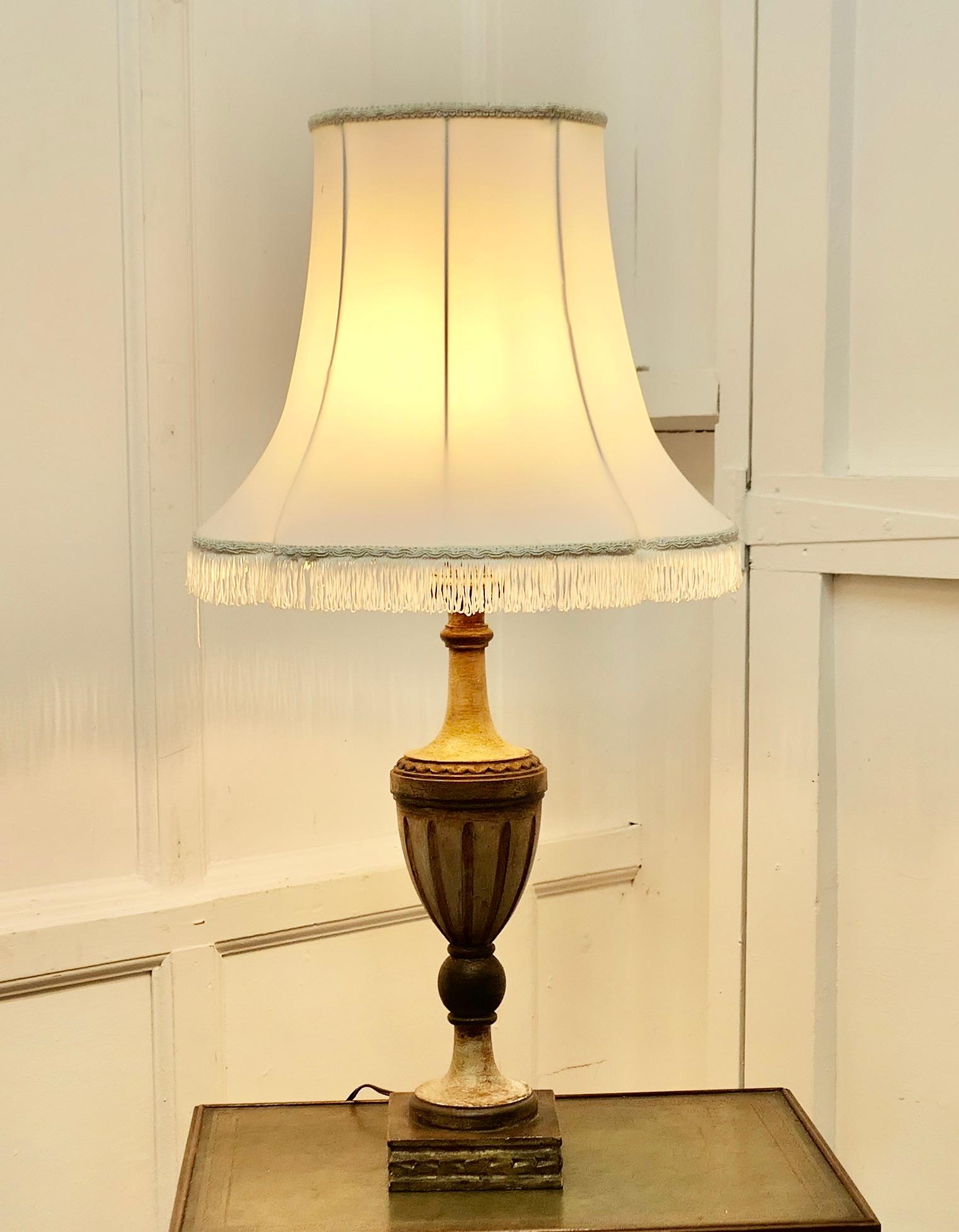 Large Carved Wooden Table Lamp

This is a great statement piece, it has a large carved base which has been finished to look like weathered stone
It comes with an oversize shade, the wiring is in good condition
The Lamp is 34” tall it stands on an 6”