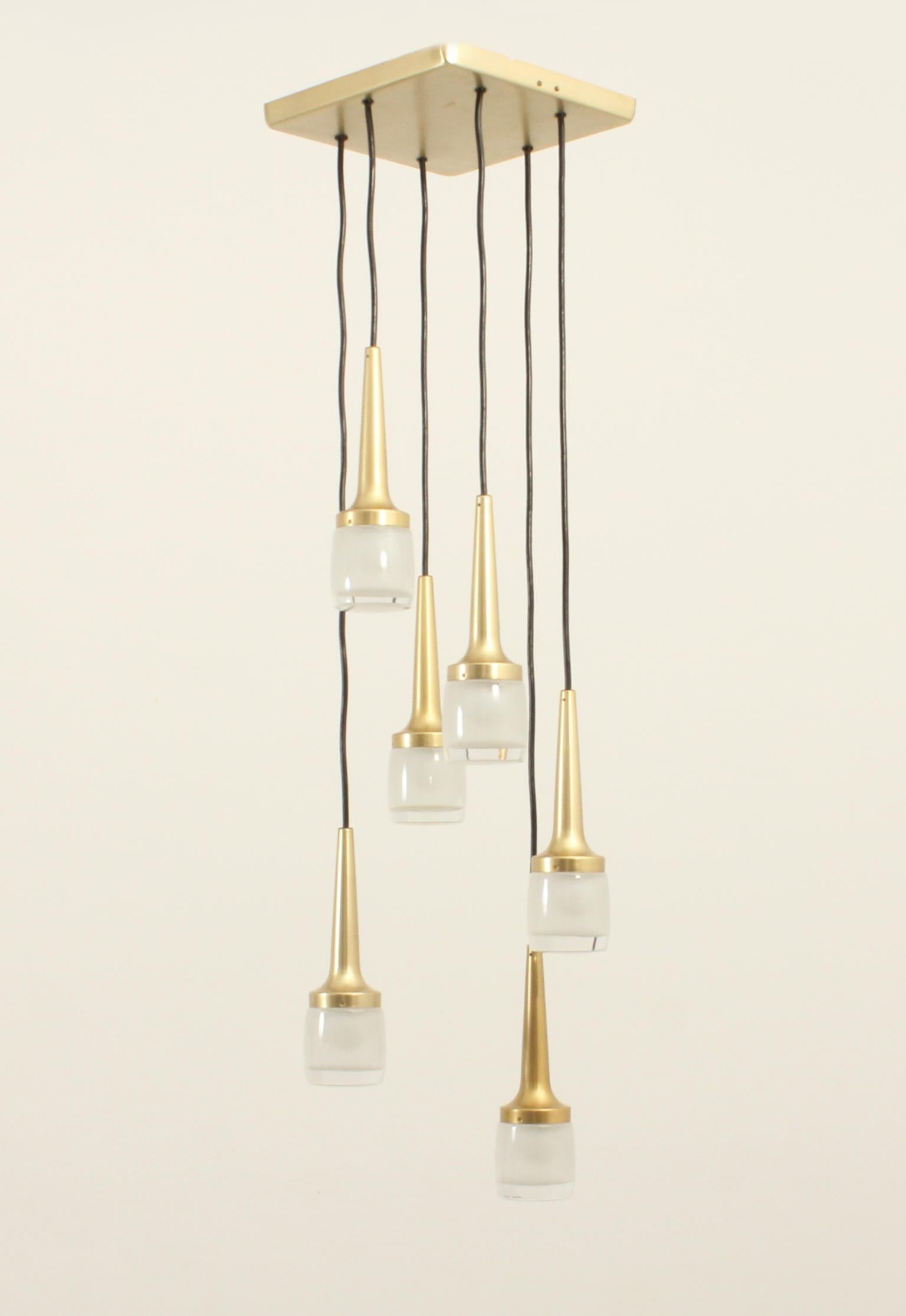 Large cascade model 9028/6 produced by Staff Leuchten in 1960's, Germany. Six lights fixtures in brassed aluminum with thick moulded glass reflectors. The wire can be adjusted in height.