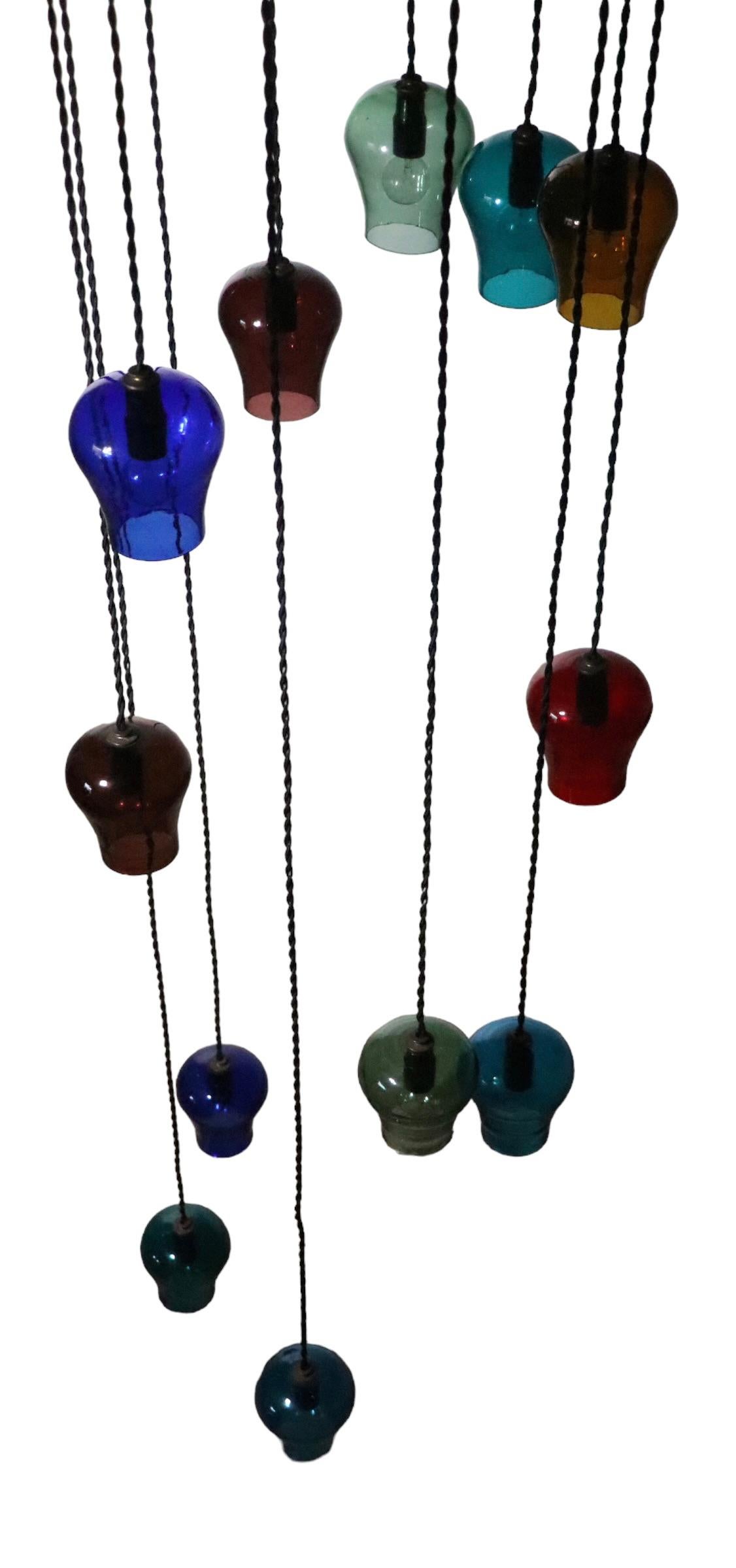  Large Cascading 12 Light  Mid Century Chandelier with Colored Glass Bell Shades In Good Condition For Sale In New York, NY