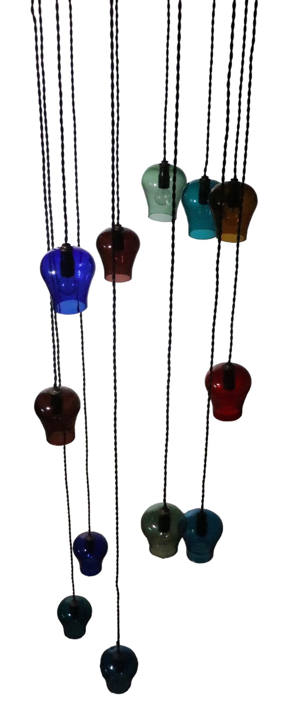 Metal  Large Cascading 12 Light  Mid Century Chandelier with Colored Glass Bell Shades For Sale