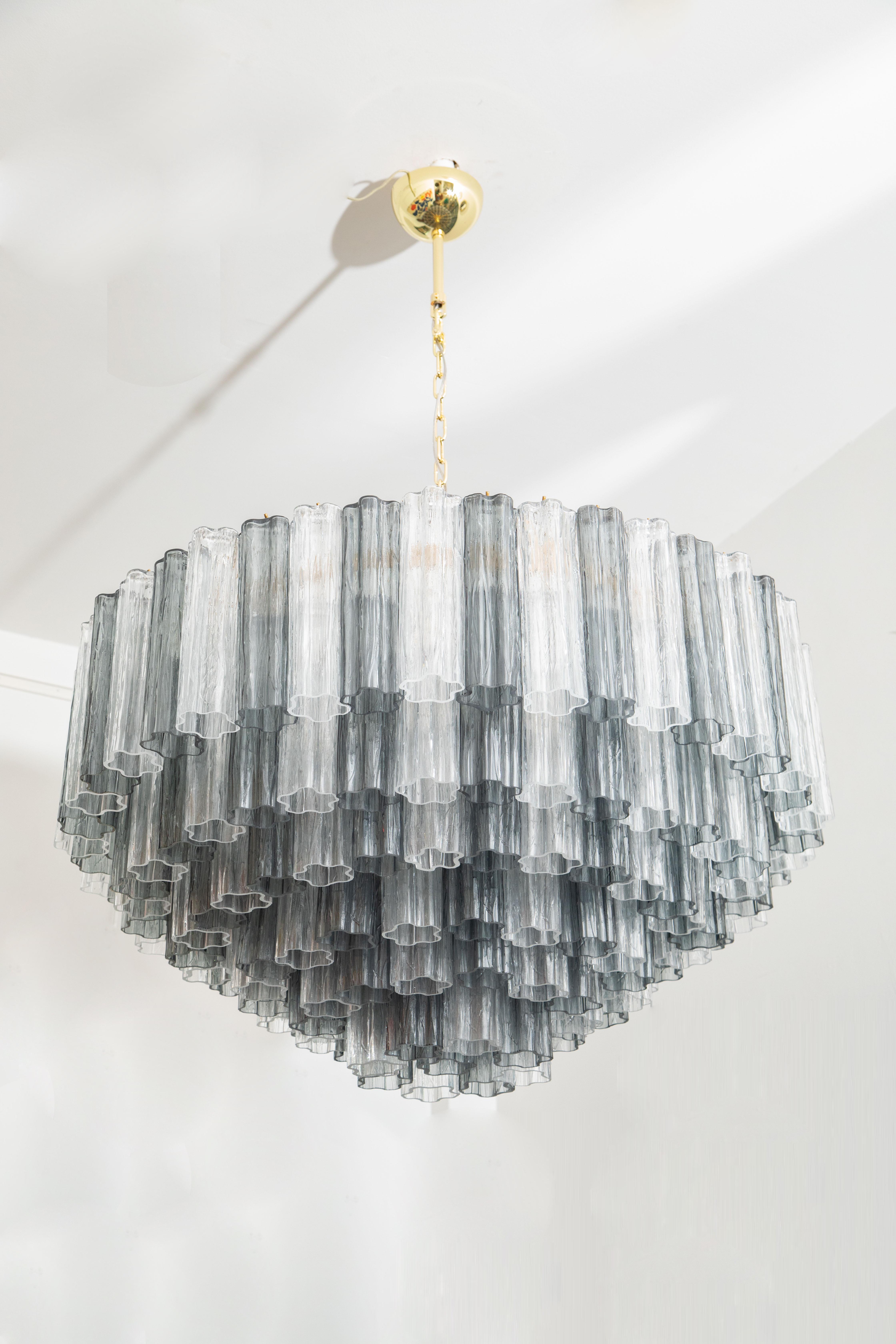 Large cascading Murano clear and teal glass chandelier, in stock 
Six tiers of 269 hand blown clear and grey textured Murano glasses, 
White enameled frame holding 12 bulbs E26
Rewired to the American standard
Possible installation with chain, stem