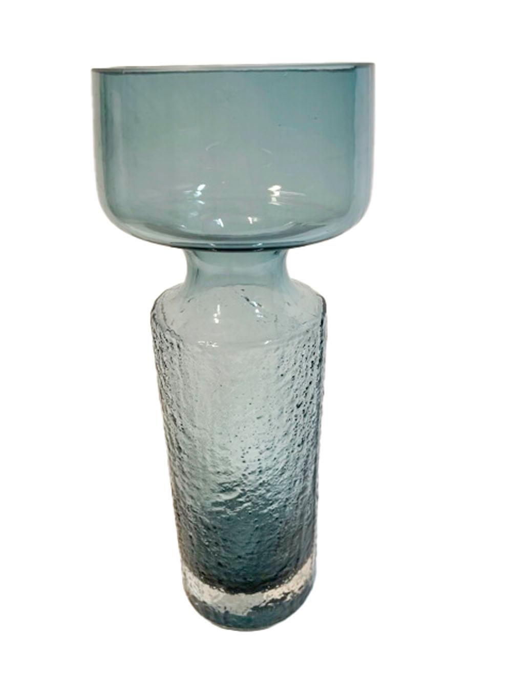 Mid-Century Modern Riihimaki 'Safari' vase in steel blue and clear cased glass. The large vase having a cylindrical base with pebble textured surface below a narrowed collar opening to a larger bowl, the pebble texture fades through the narrowed