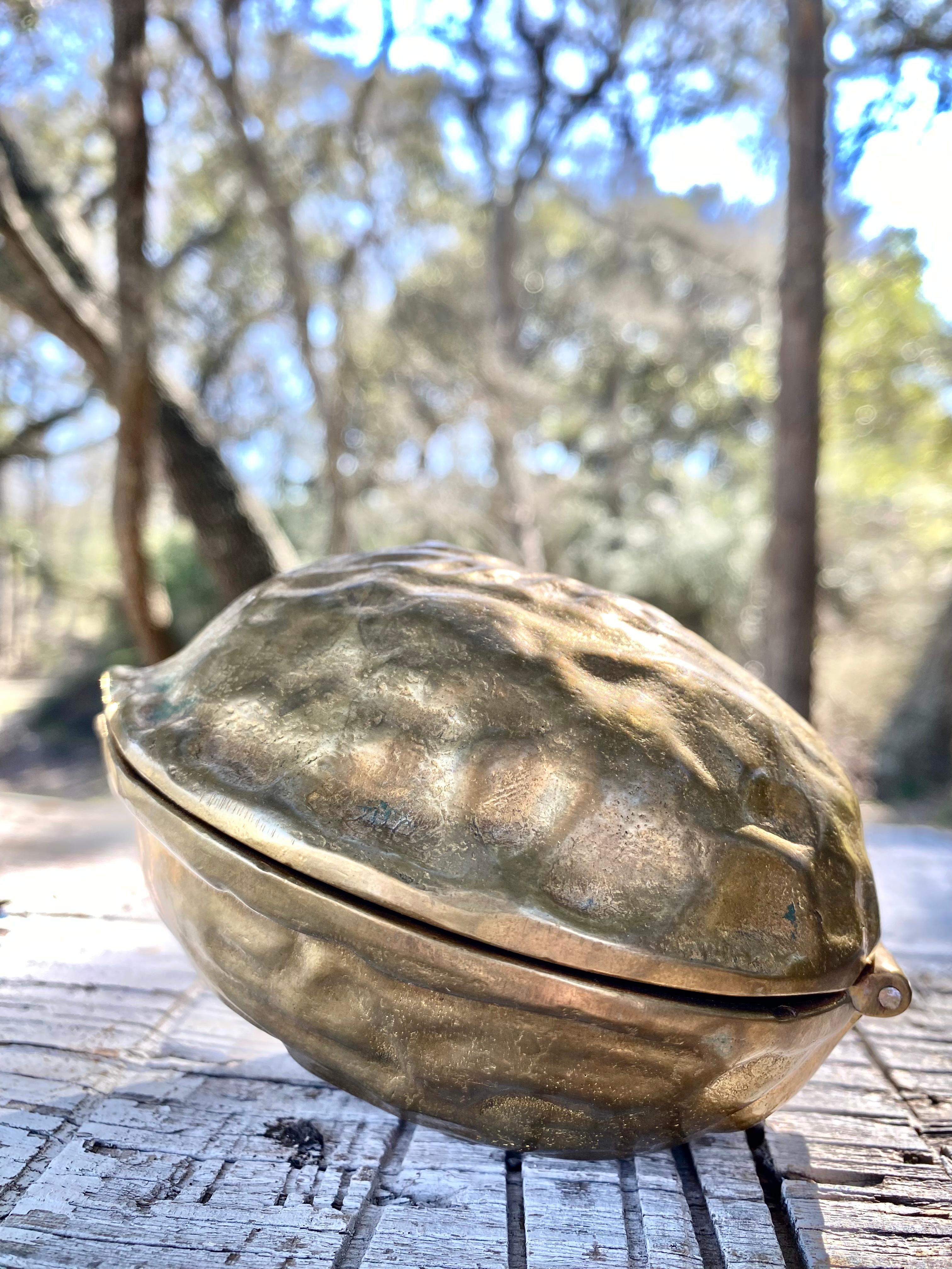 Extra large, heavyweight, sculptural cast brass walnut paperweight or nutcracker that is truly art. We love this on a desk as a whimsical display piece.

With the large size, and functionality (it cracks nuts well), this is the perfect gift for a