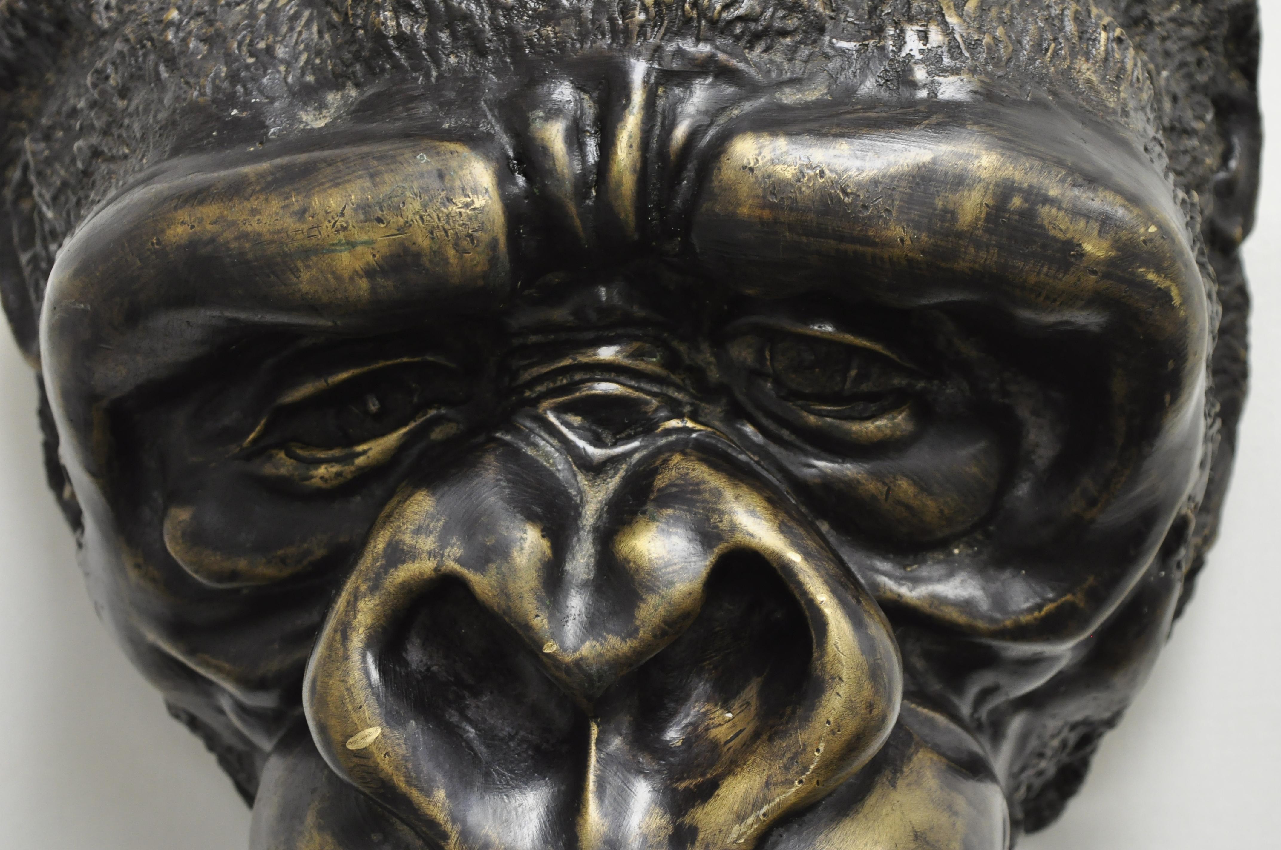 Large and impressive cast bronze gorilla head wall sculpture for a Taxidermy collector (A). Item features heavy cast bronze construction, remarkable life-like details, large impressive size, holes to rear to hang on wall, weighs approximately 22lbs,