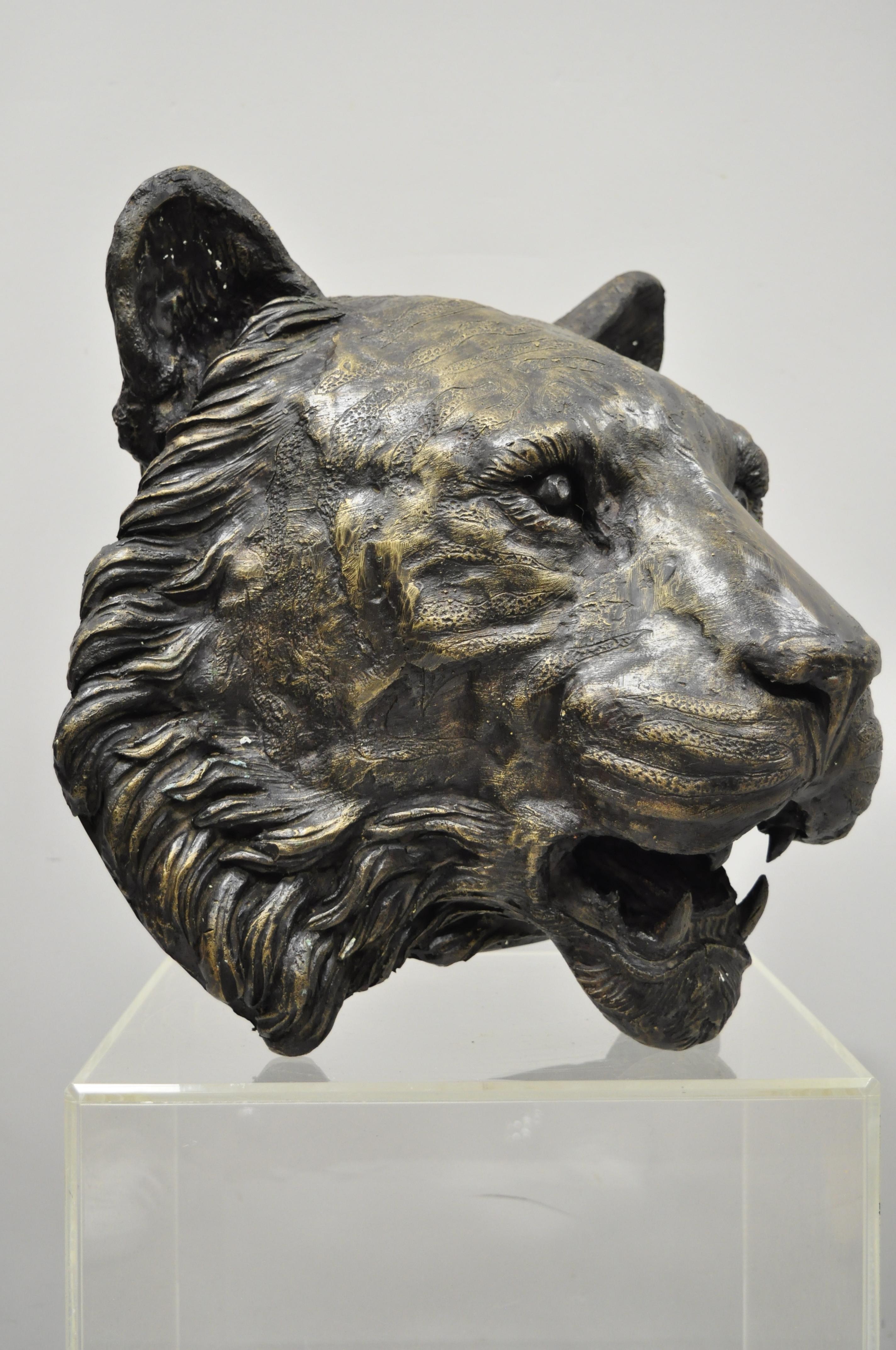 Large and impressive cast bronze tiger head wall sculpture for a Taxidermy Collector. Item features heavy cast bronze construction, remarkable life-like details, large impressive size, holes to rear to hang on wall, tiger weighs approximately 47lbs,