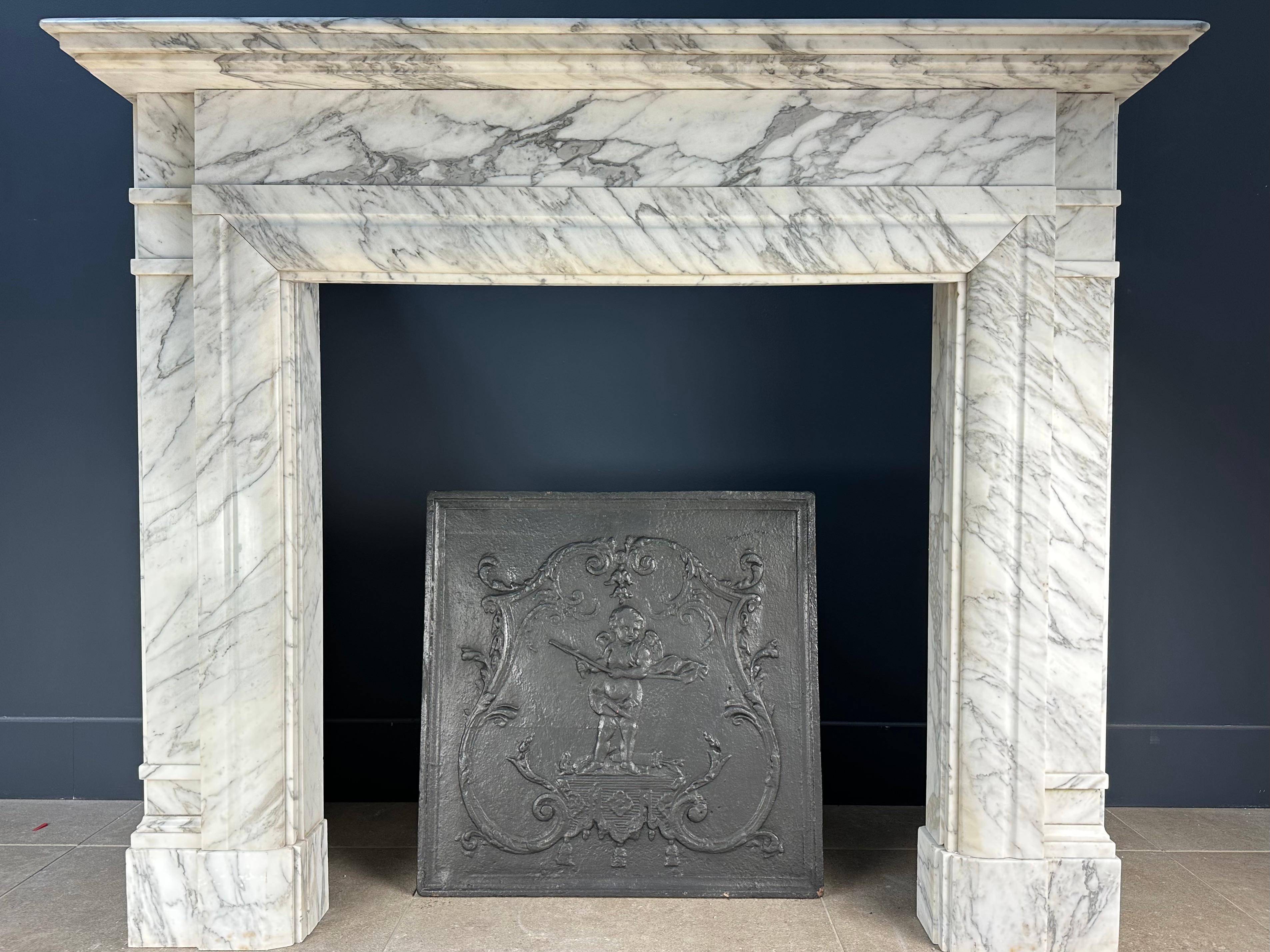 Beautiful large antique cast iron fireback. Due to its size, this fireback has a luxurious look. The fireback can be placed in a working fireplace against the fire wall or placed as a style item in an antique fireplace.