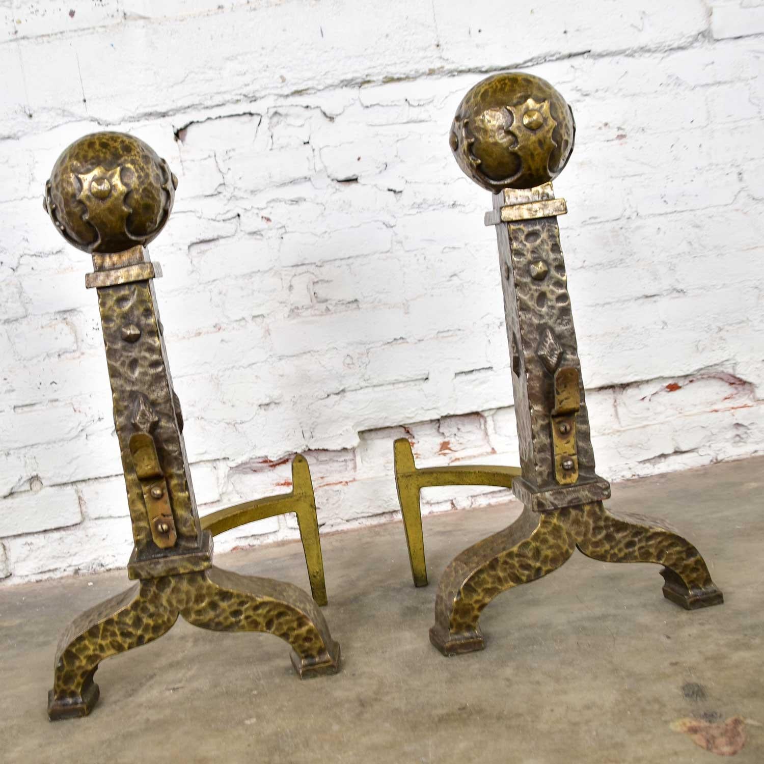 Handsome pair of large cast iron Arts & Crafts cannonball andirons or fire dogs with bronze-plated hammered finish. Gorgeous vintage condition. Please see photos, circa early 20th century.

Is there anything better than snuggling up with your