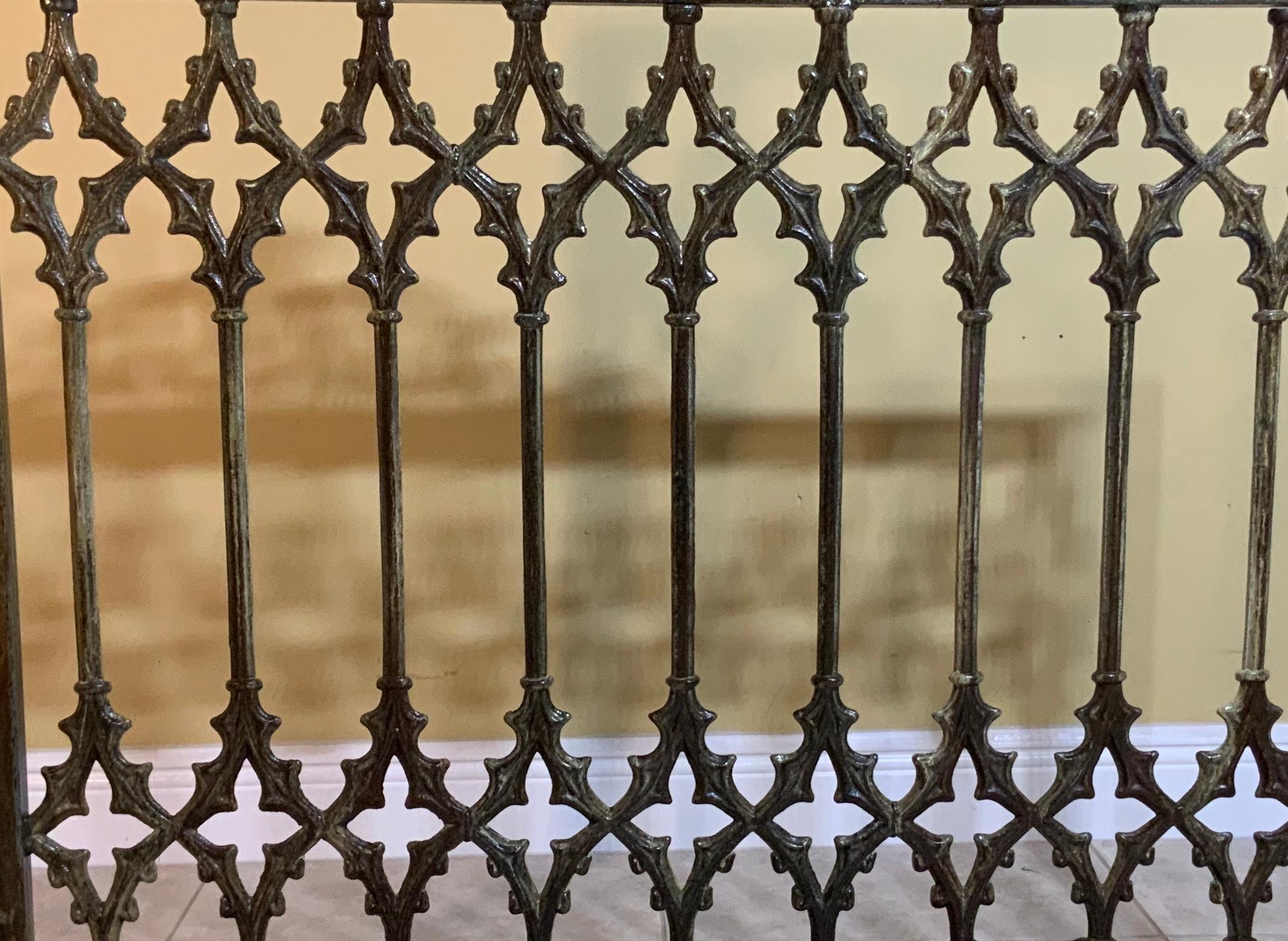 Beautiful fireplace screen made of cast iron with artistic cathedral motifs all around, treated and sealed for rust, great object of art for display.