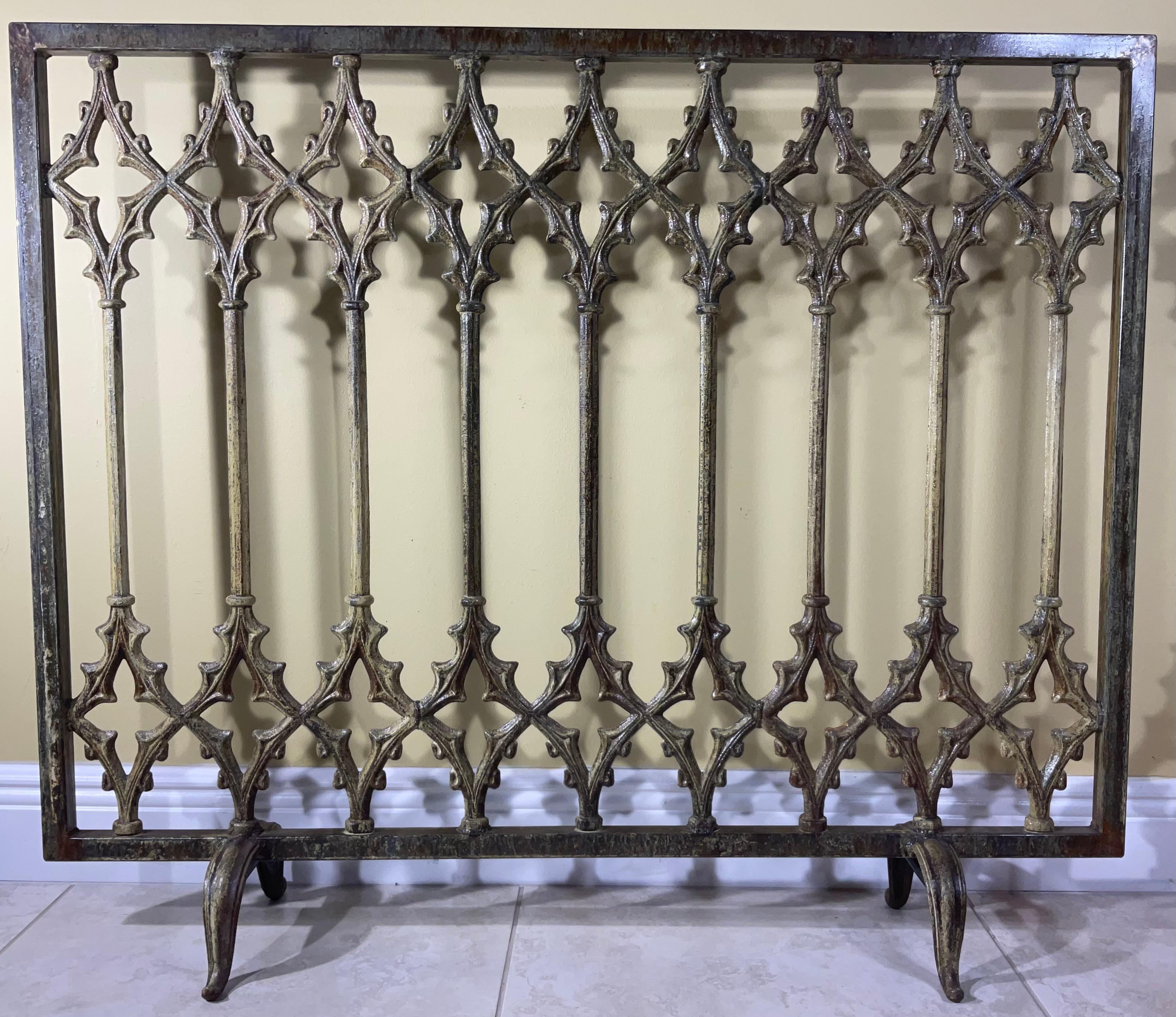 Beautiful fireplace screen made of cast iron with artistic cathedral motifs all around, treated and sealed for rust, could use two sides. Great object of art for display.