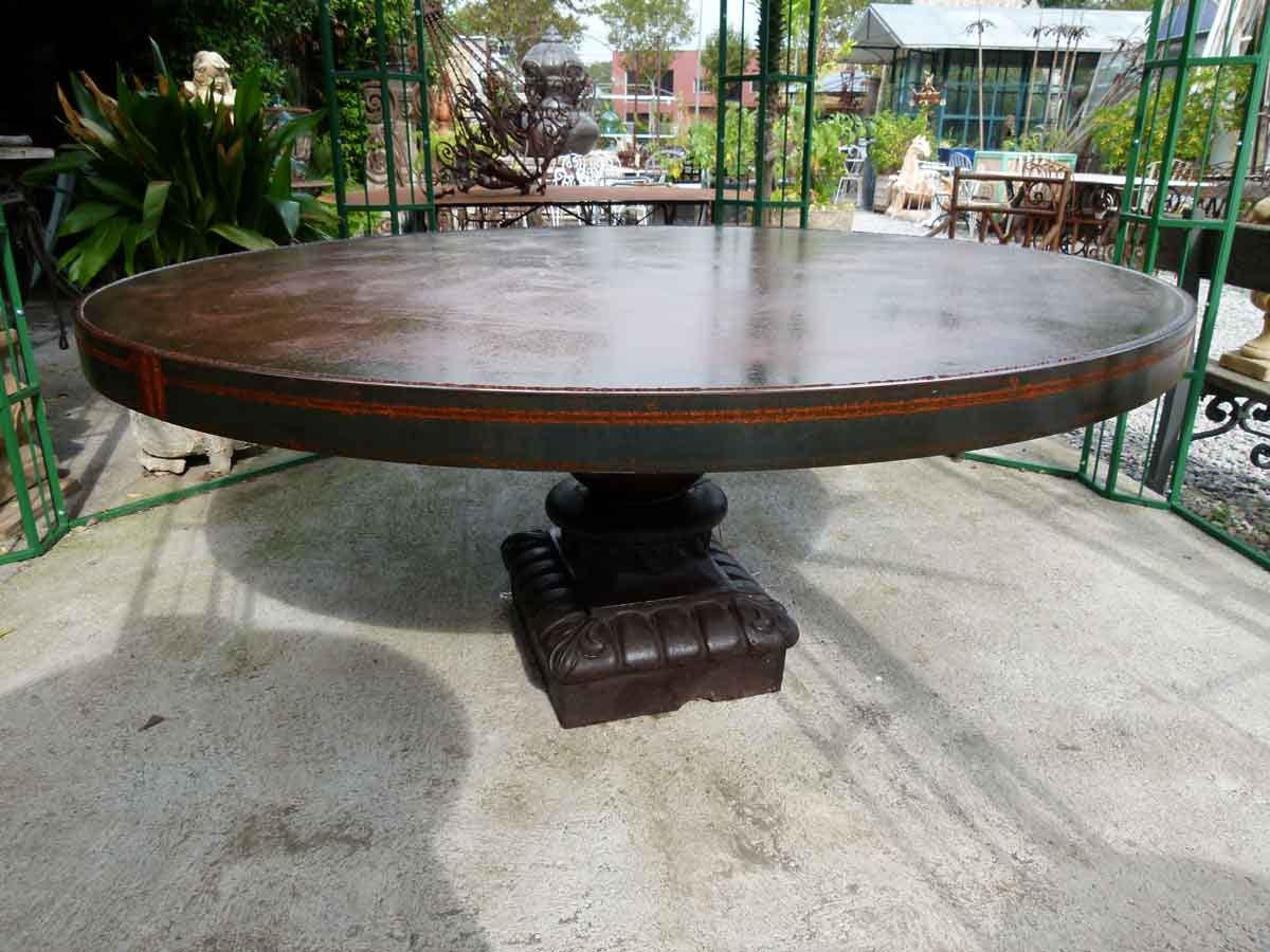 Large cast iron round table. A combination of old and modern styles that makes it a unique piece. The cast iron base is from the 19th century and the circular iron top plate from the 20th century.
Outstanding table, interior or exterior, it is a