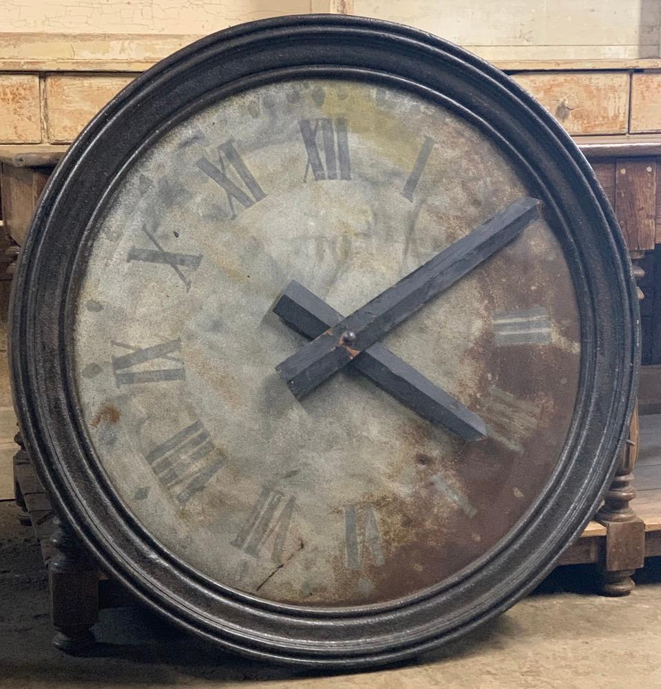 A stunning large 19th century French tower clock face made from iron which has old weathered paint. Fitted with later hands it now has a nice decorative look for the indoors or garden. This clock is not working and is sold as a decorative piece.