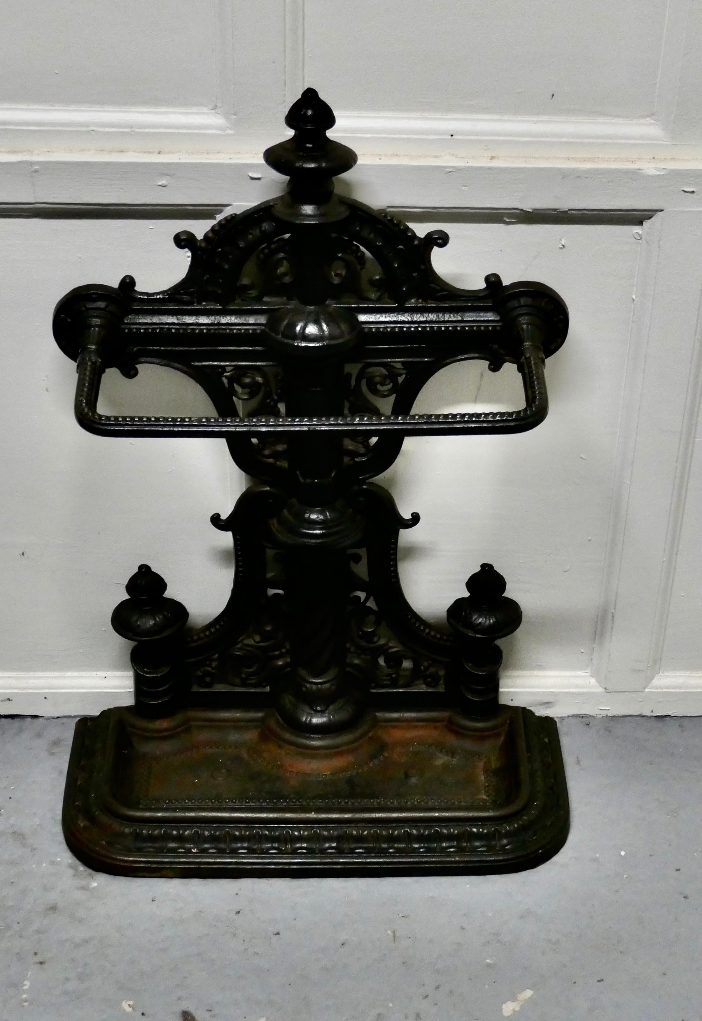 Large cast iron umbrella stick stand

An exceptional quality and attractive 19th century cast iron hall stand.
This ornate stand has a broad support rail and removable umbrella drip tray, with a tall decorative back
This impressive cast iron