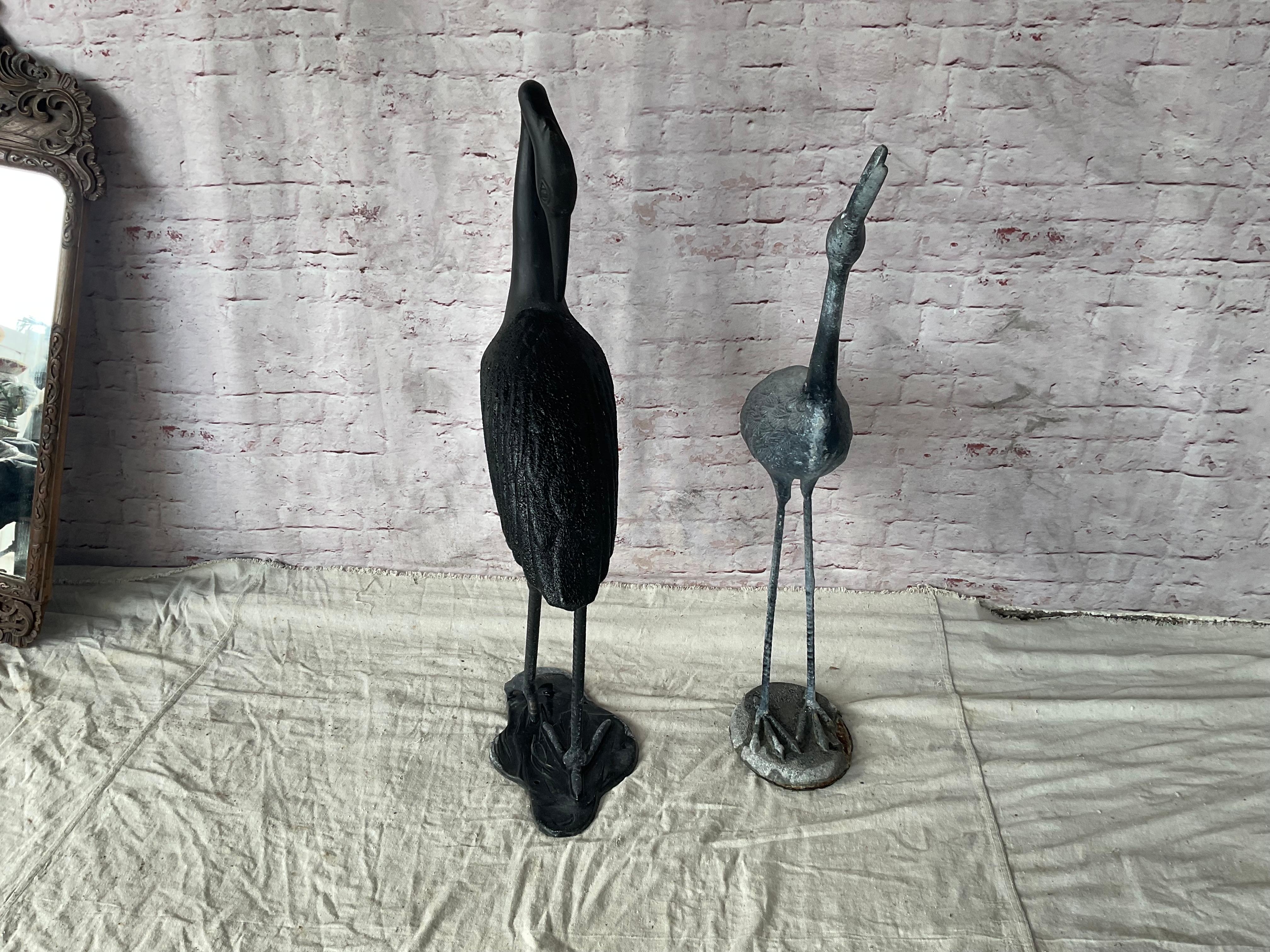 Large Cast Metal Cranes, A Pair In Good Condition For Sale In Bradenton, FL