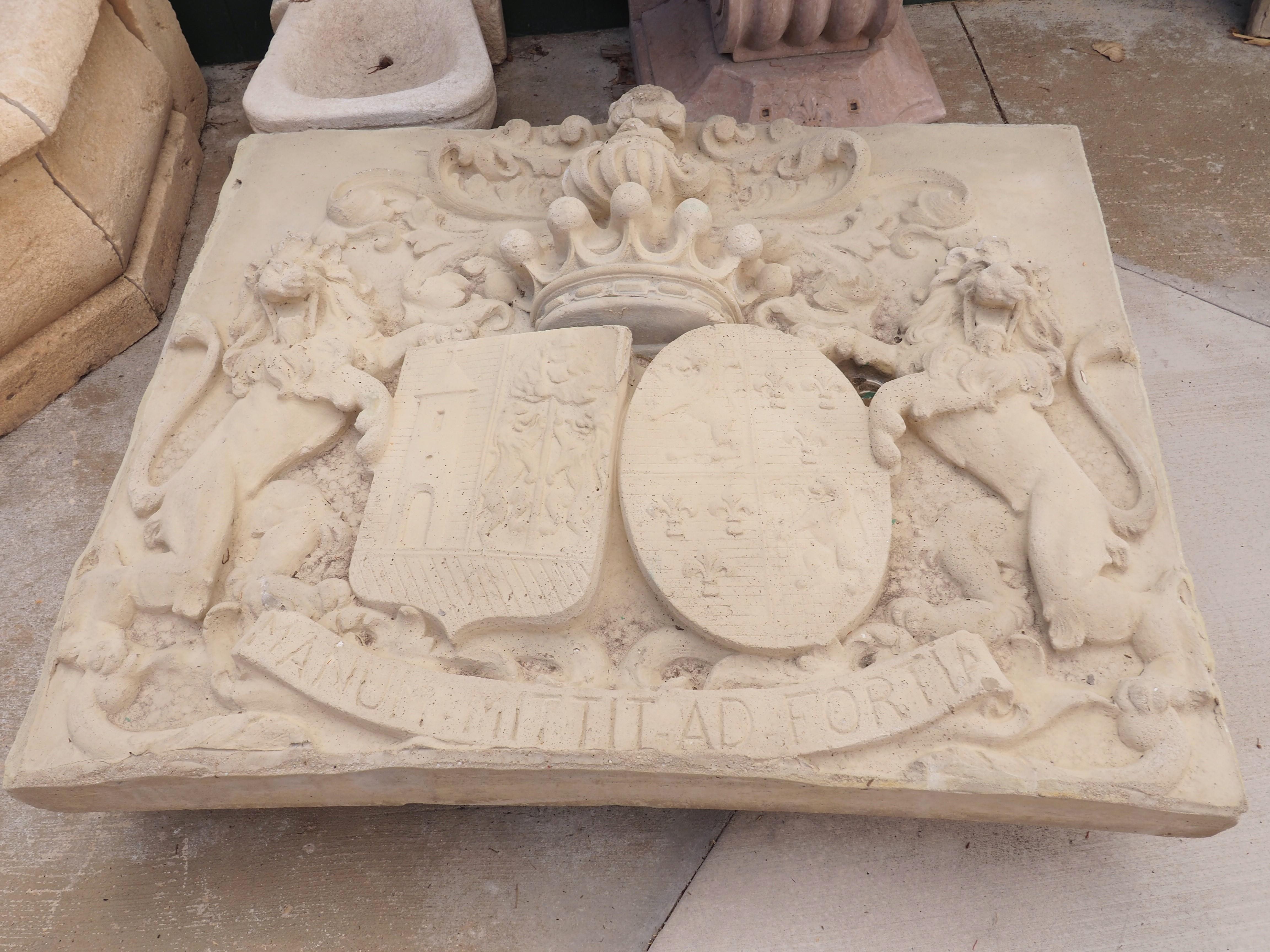 After a stone panel that once graced the front of a Belgian castle, this large cast stone plaque features an intricate coat of arms, quite possibly from the Crawhez family. The heraldic display was referenced in 1861 by Jean-Baptiste Rietstap, a