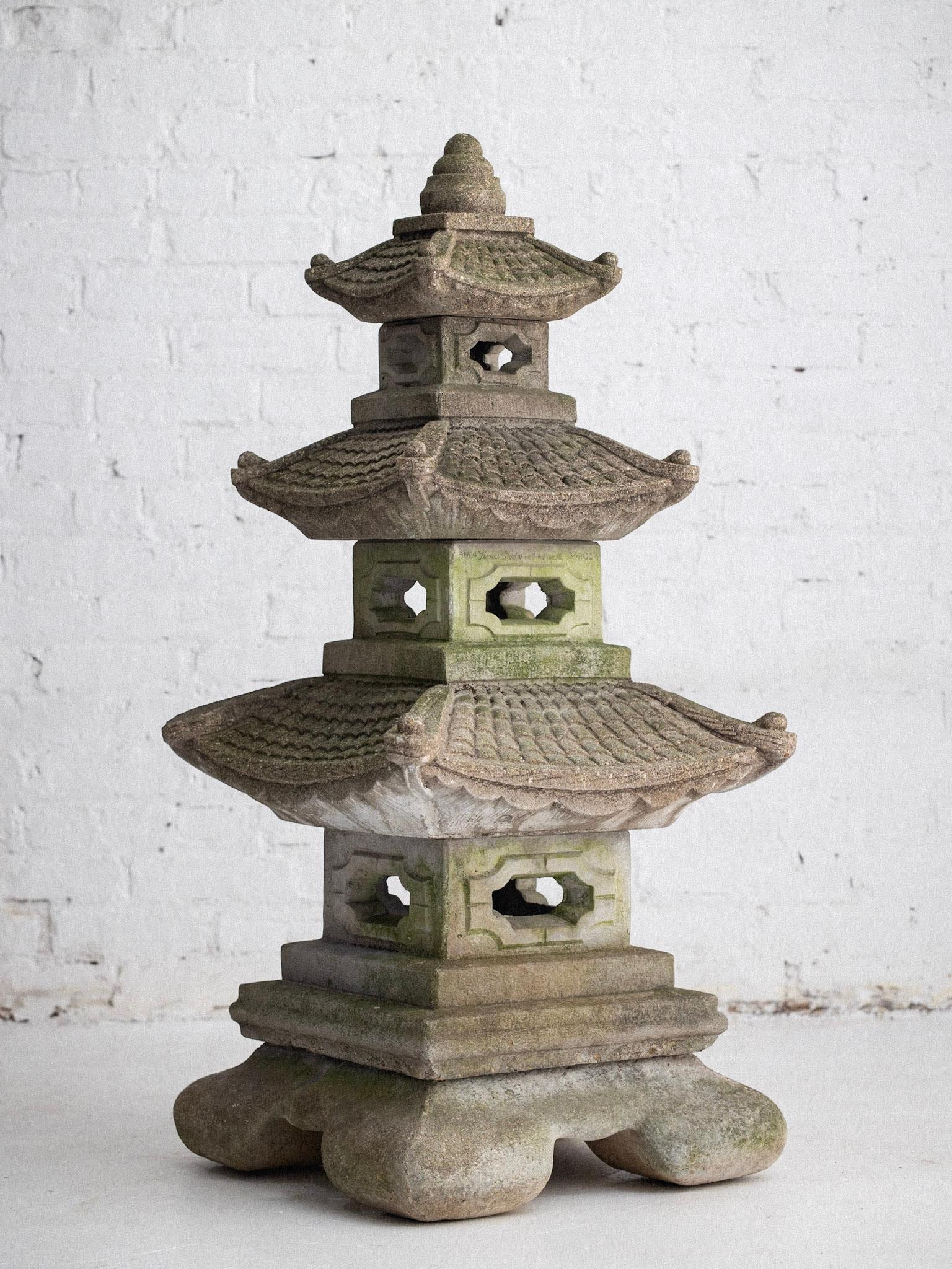 A mid century cast stone garden pagoda. Consists of five stacking pieces. Beautiful naturally developed patina.