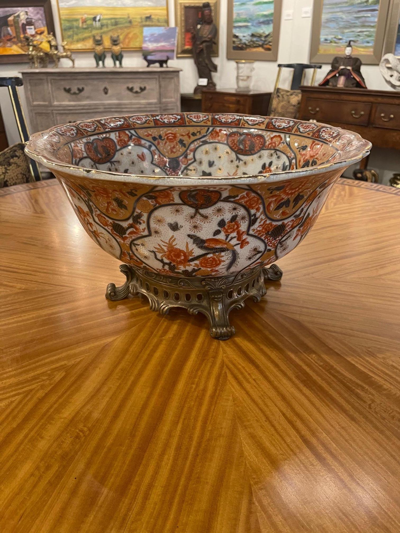 Large Castilian porcelain bowl on brass stand, 20th century. Bowl is attached to stand.