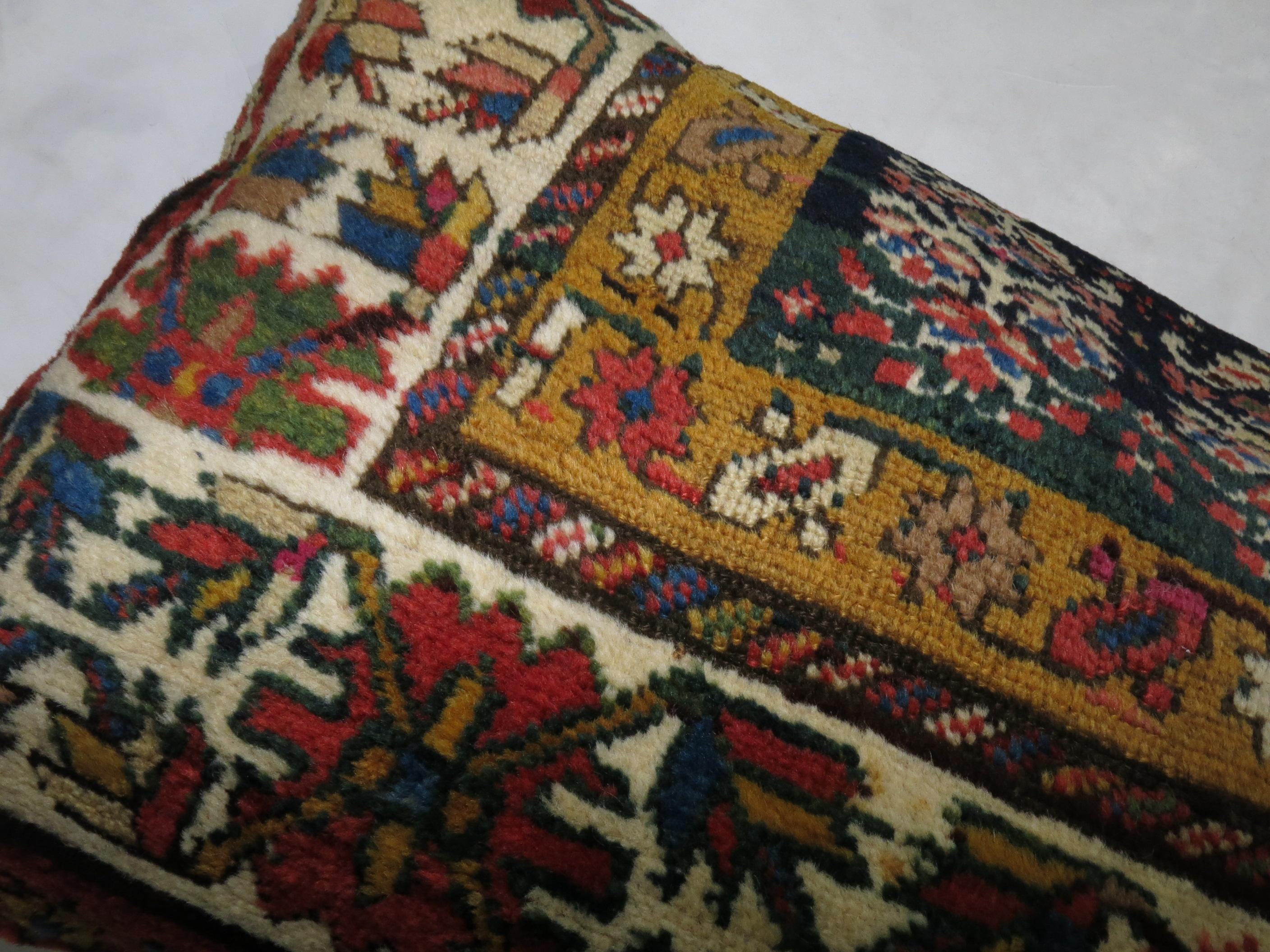 Pillow made from an antique Caucasian Shirvan rug with zipper closure included.