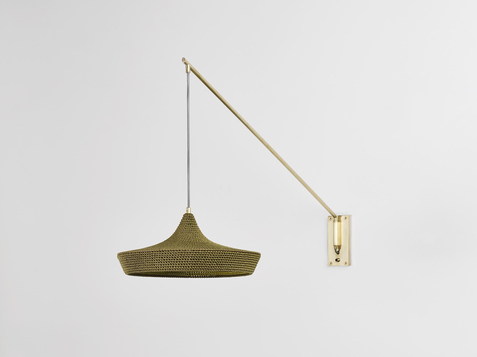 Large cave wall lamp by Naomi Paul
Dimensions: D 50 x W 102 x H 58 cm
Materials: Metal frame, Egyptian cotton cord.
Color: Olive and Green Gold inside edge.
Available in other colors and in 2 sizes: D30 x W50, D50 x W102 cm.
Available in Inside
