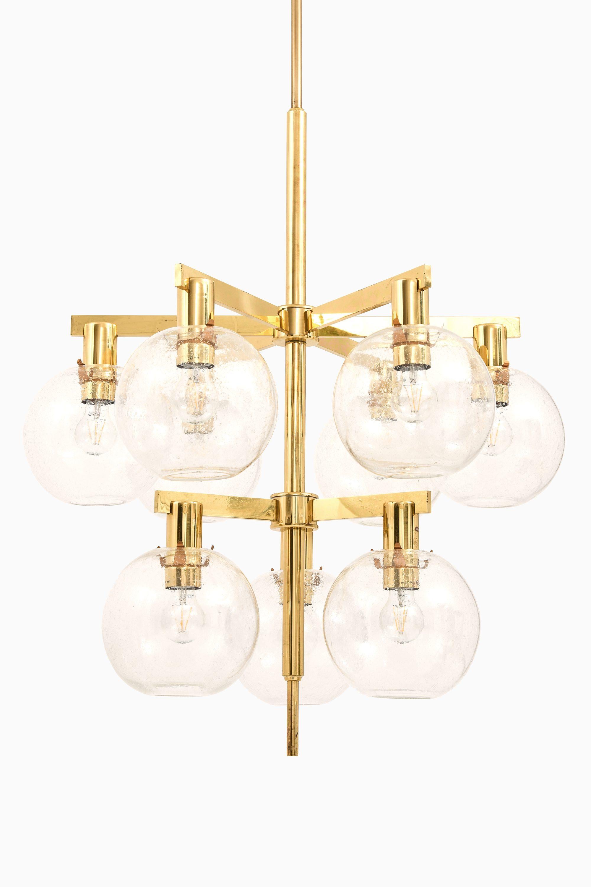 Large Ceiling Lamp / Chandelier in Brass and Glass by Hans-Agne Jakobsson, 1950's

Additional Information:
Material: Brass and glass
Style: Mid century, Scandinavian
Rare ceiling lamp model T 348/9
Produced by Hans-Agne Jakobsson AB in Markaryd,