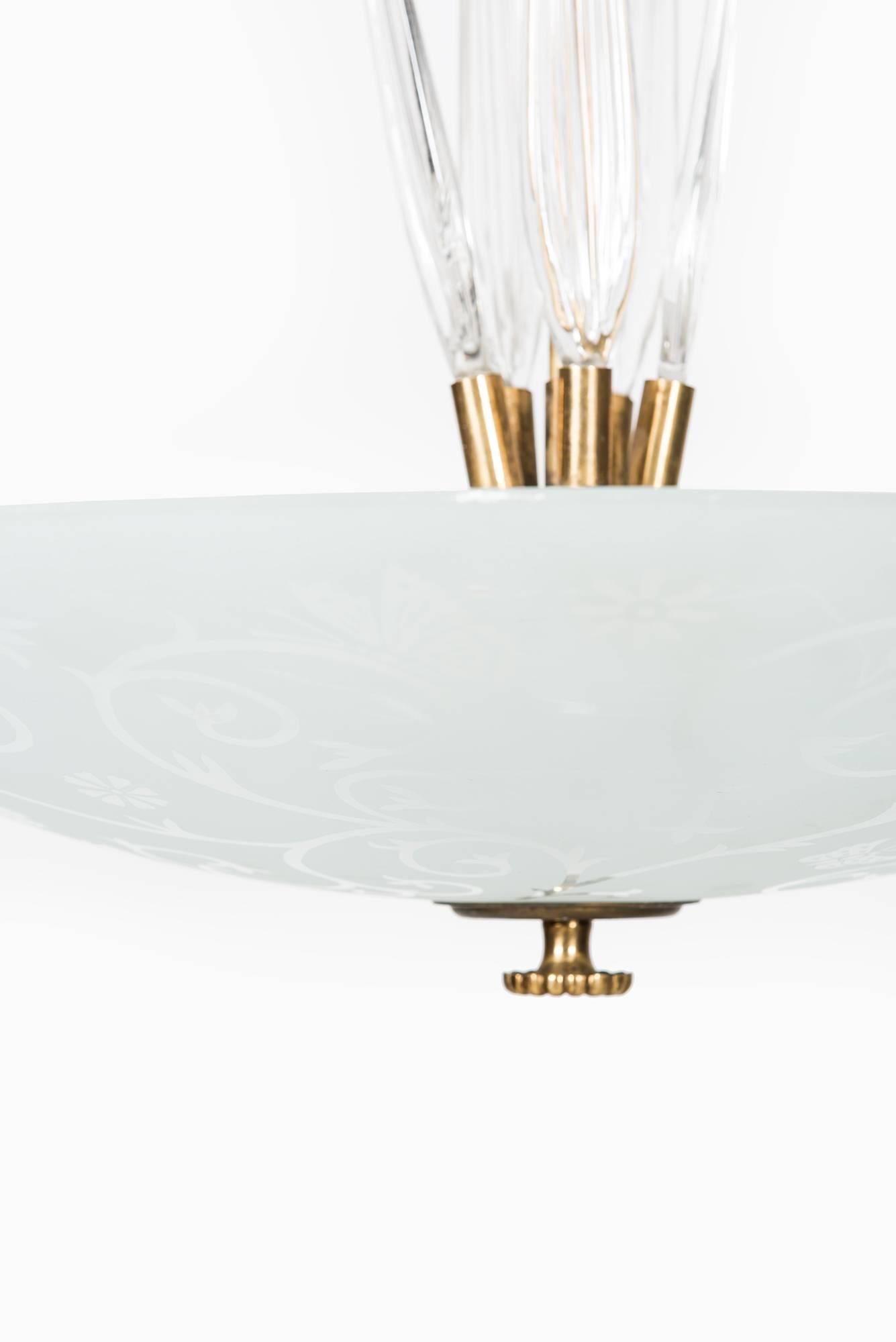 Rare and large ceiling lamp. Produced by Orrefors in Sweden.