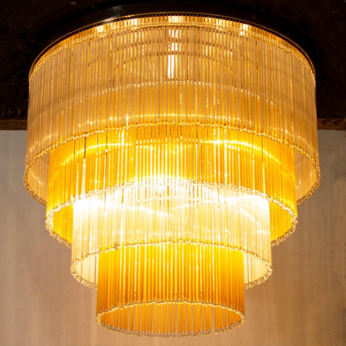 Large ceiling lamp chandelier diameter Ø70 cm with glass rods and pearl Made in Italy in amber silk Murano glass.

Additional information:
Material: Glass, Metal, Murano Glass
Color: Transparent, Gold, Ivory, White
Design period: 1980 - 1989
Country
