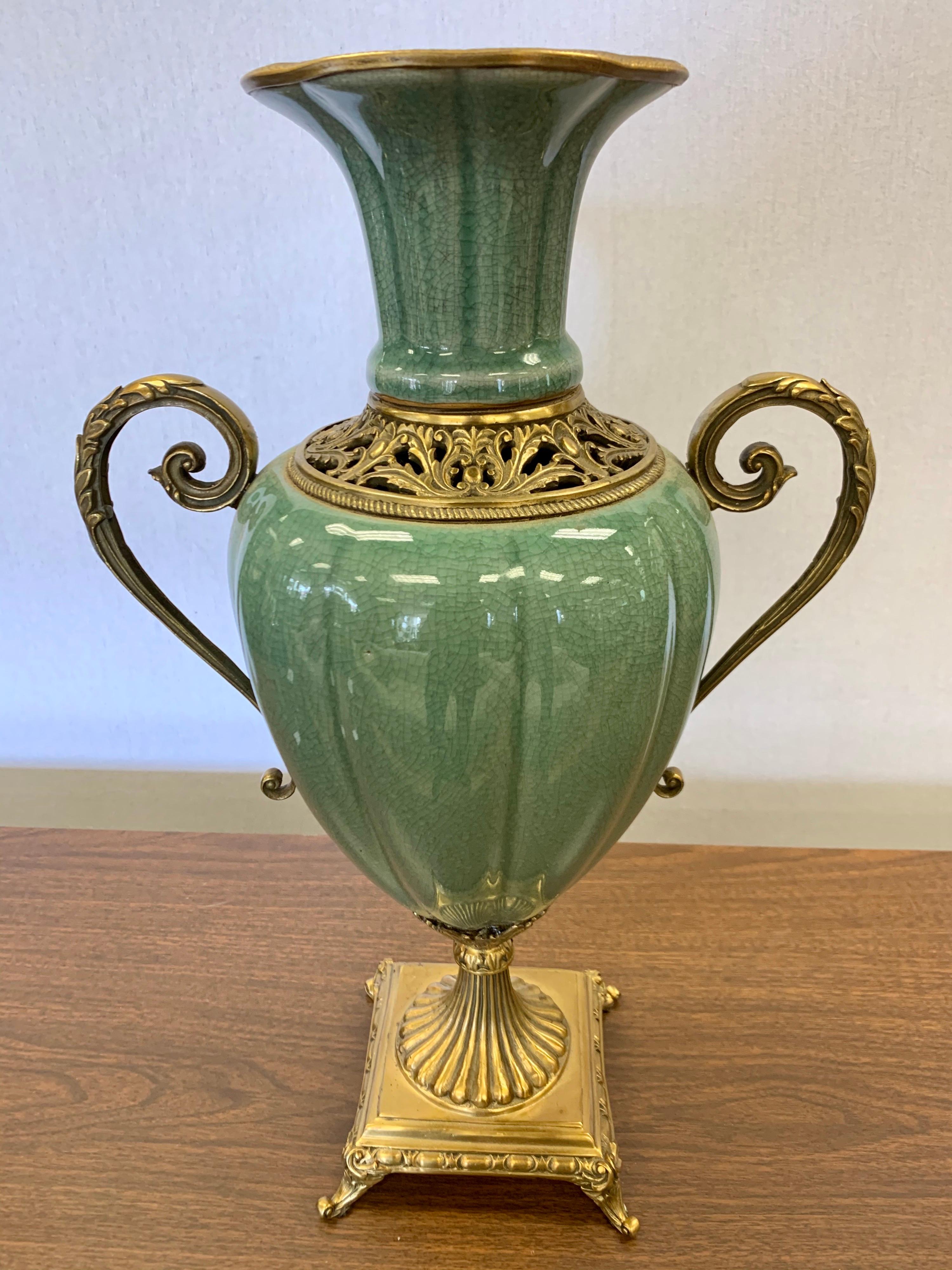 Elegant celadon porcelain large vase or urn with brass handles and mounts. The colors are spectacular.
Great scale as well. Now, more than ever, home is where the heart is.
